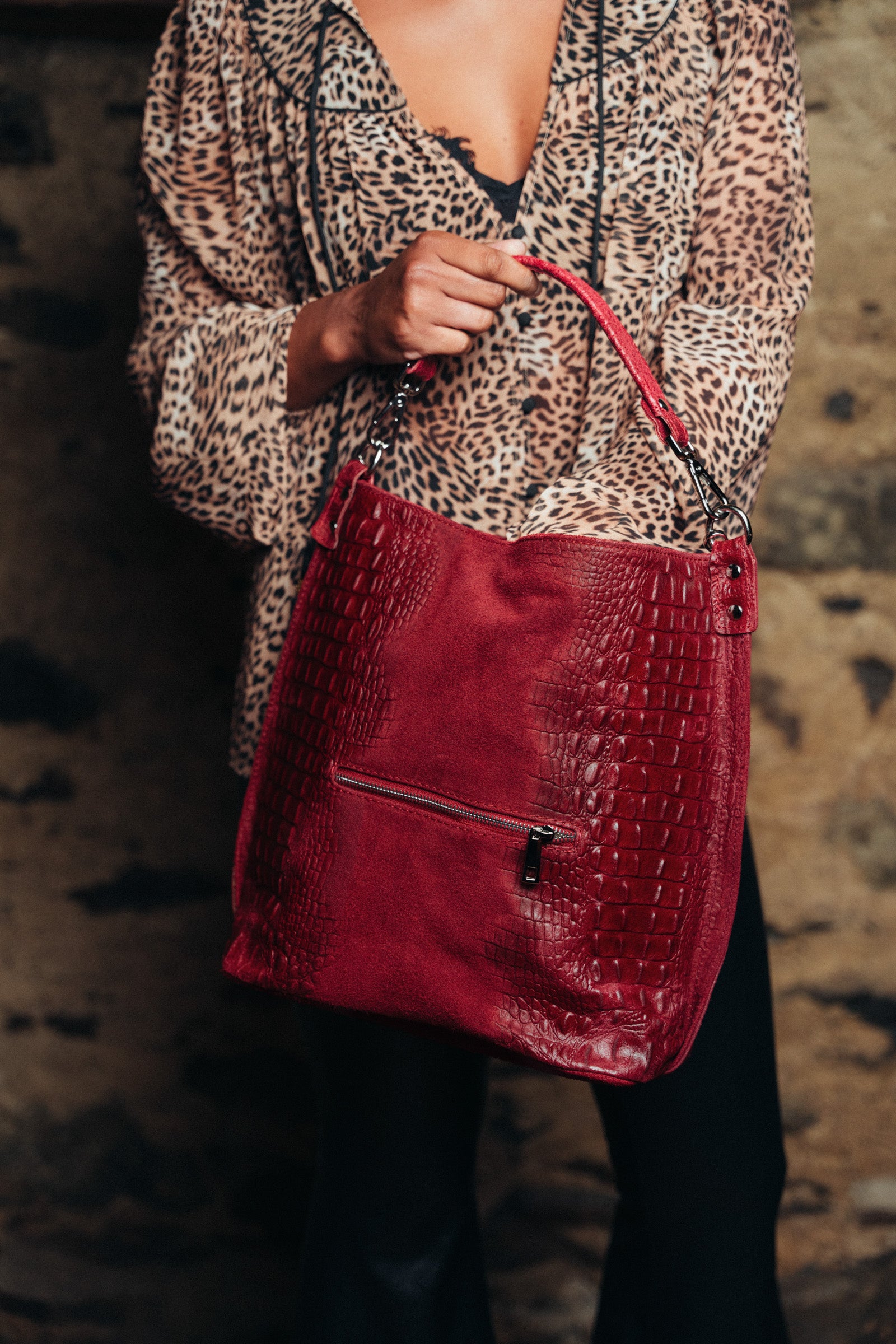 Little Lies Rapture Ruby Genuine Suede Slouch Bag styled with band tee and flares