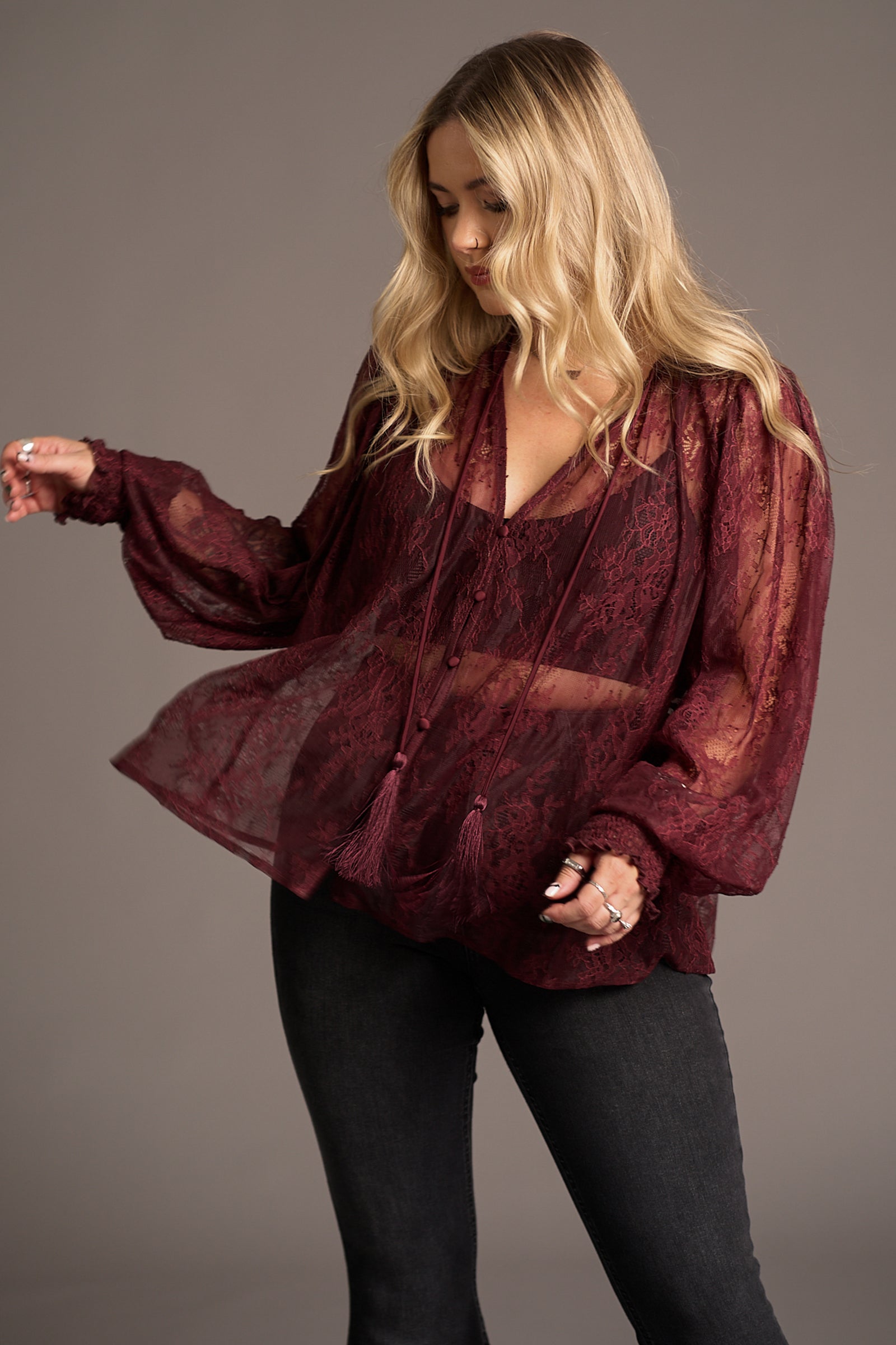 Erin wears Rhiannon Burgundy Lace Smock Top over flared jeans, Stevie Nicks inspired styling studio