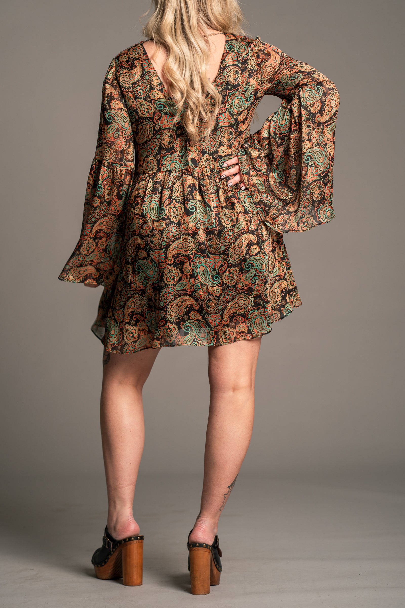 Back view of Little Lies Ringo paisley smock dress with relaxed silhouette, flared sleeves and tie back neckline