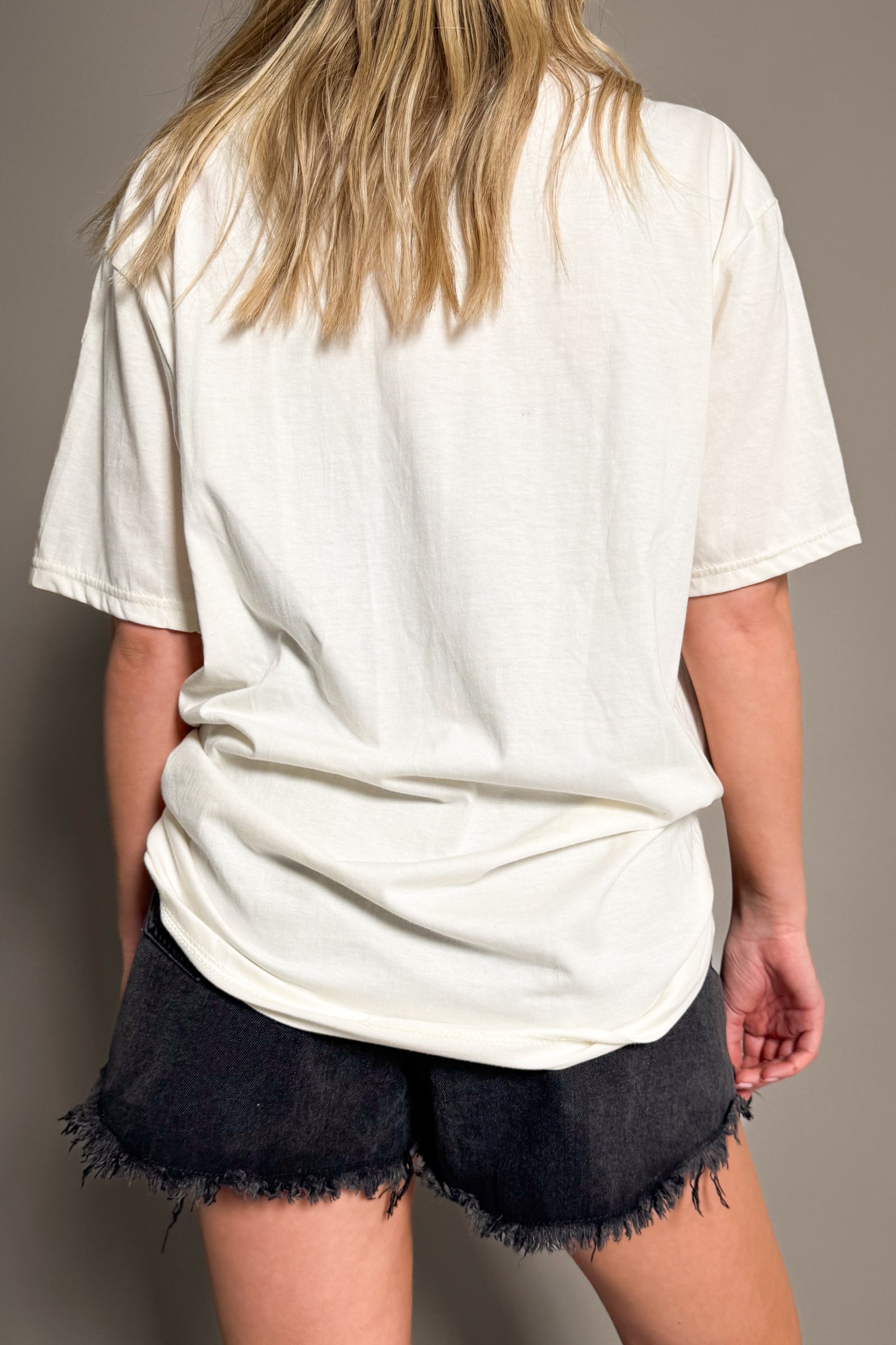 Back view of Rolling Stones Graffiti band tee in off-white with relaxed oversized fit