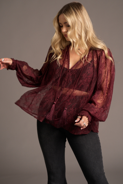 Erin wears Rhiannon Burgundy Lace Smock Top over flared jeans, Stevie Nicks inspired styling studio