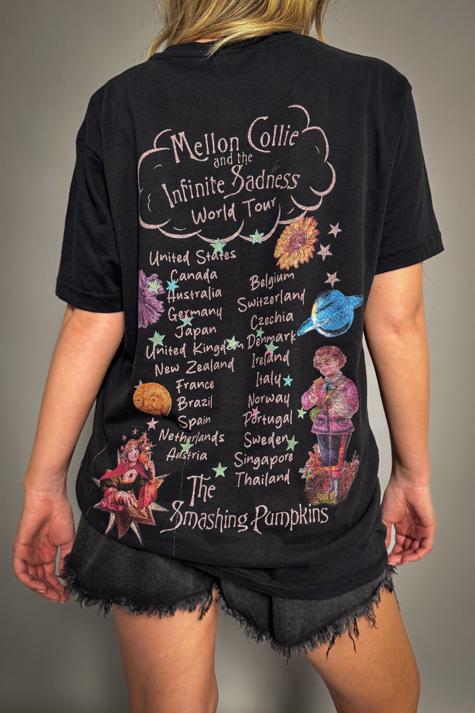 Back view of Little Lies The Smashing Pumpkins band tee with Mellon Collie and the Infinite Sadness world tour graphic and list of tour locations