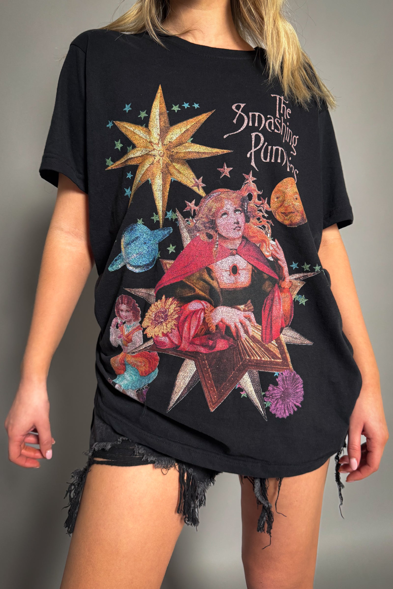 Little Lies The Smashing Pumpkins celestial band tee in black with colourful star, planet and character graphic from Mellon Collie tour and relaxed fit