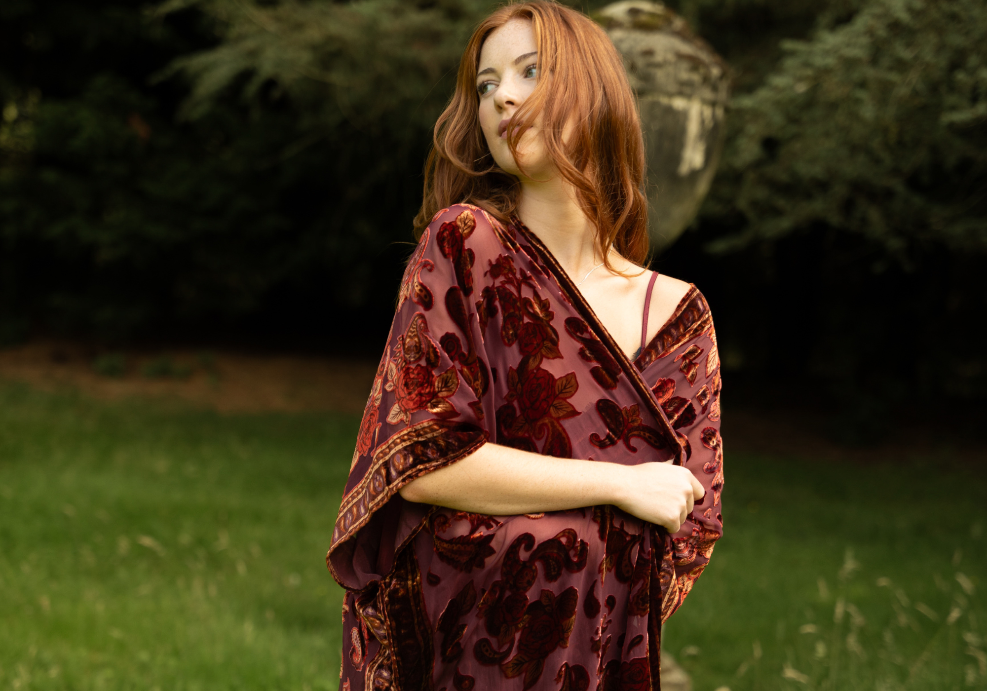Anna wearing the Stevie Plum Paisley devore fringed kimono in the estate garden at Byre at Inchyra.