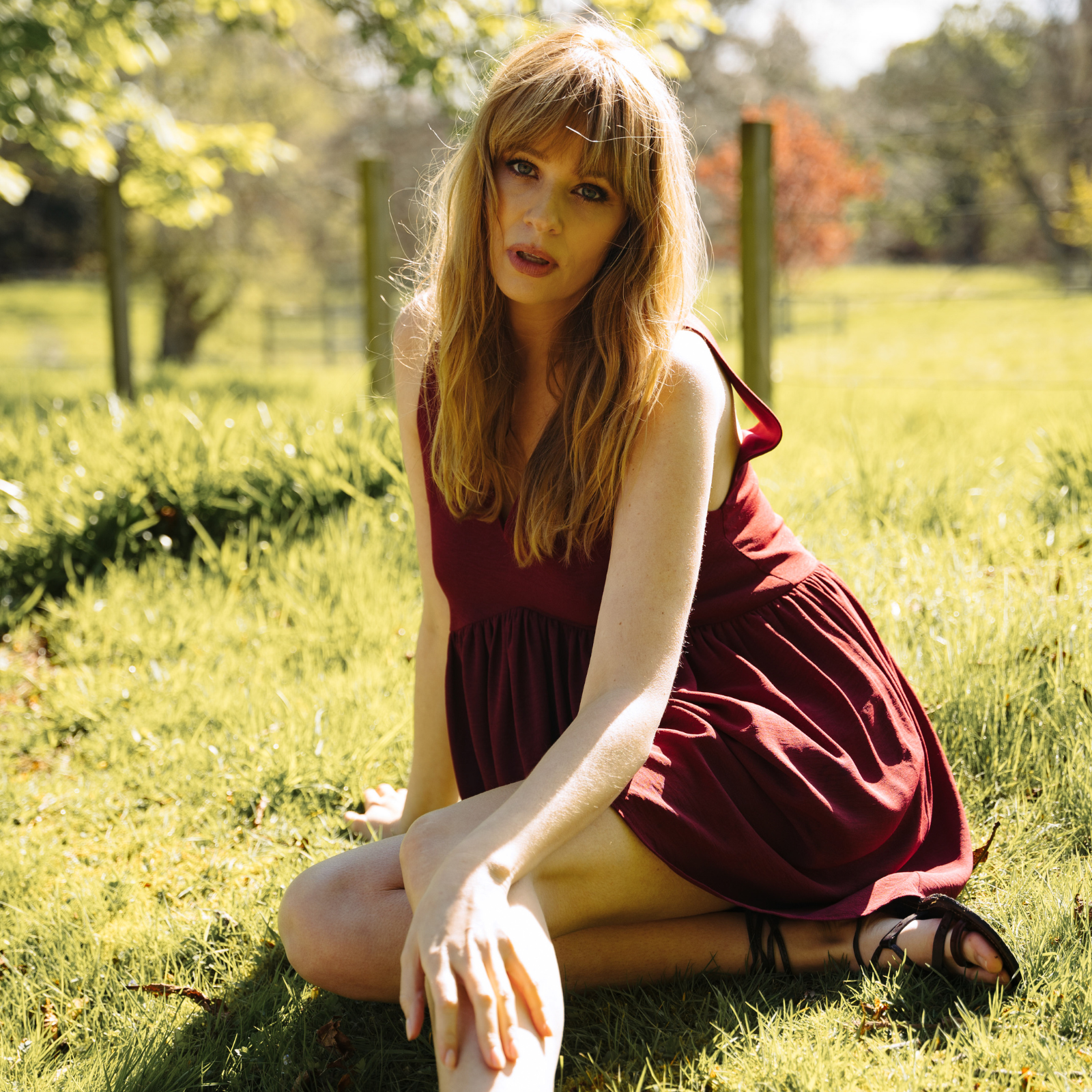 Model Tinna wearing the Grace Plum Smock Dress, featuring the perfect smock shape, V-neckline front and back and a back tie. Perfect Bohemian festival dress