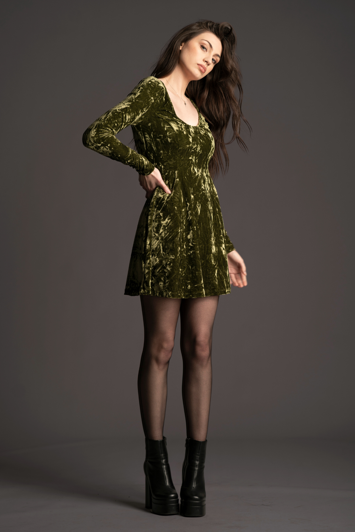 Andie wearing the iconic Sweet Jane Olive Crushed Velvet Mini Dress, as worn by Taylor Swift.