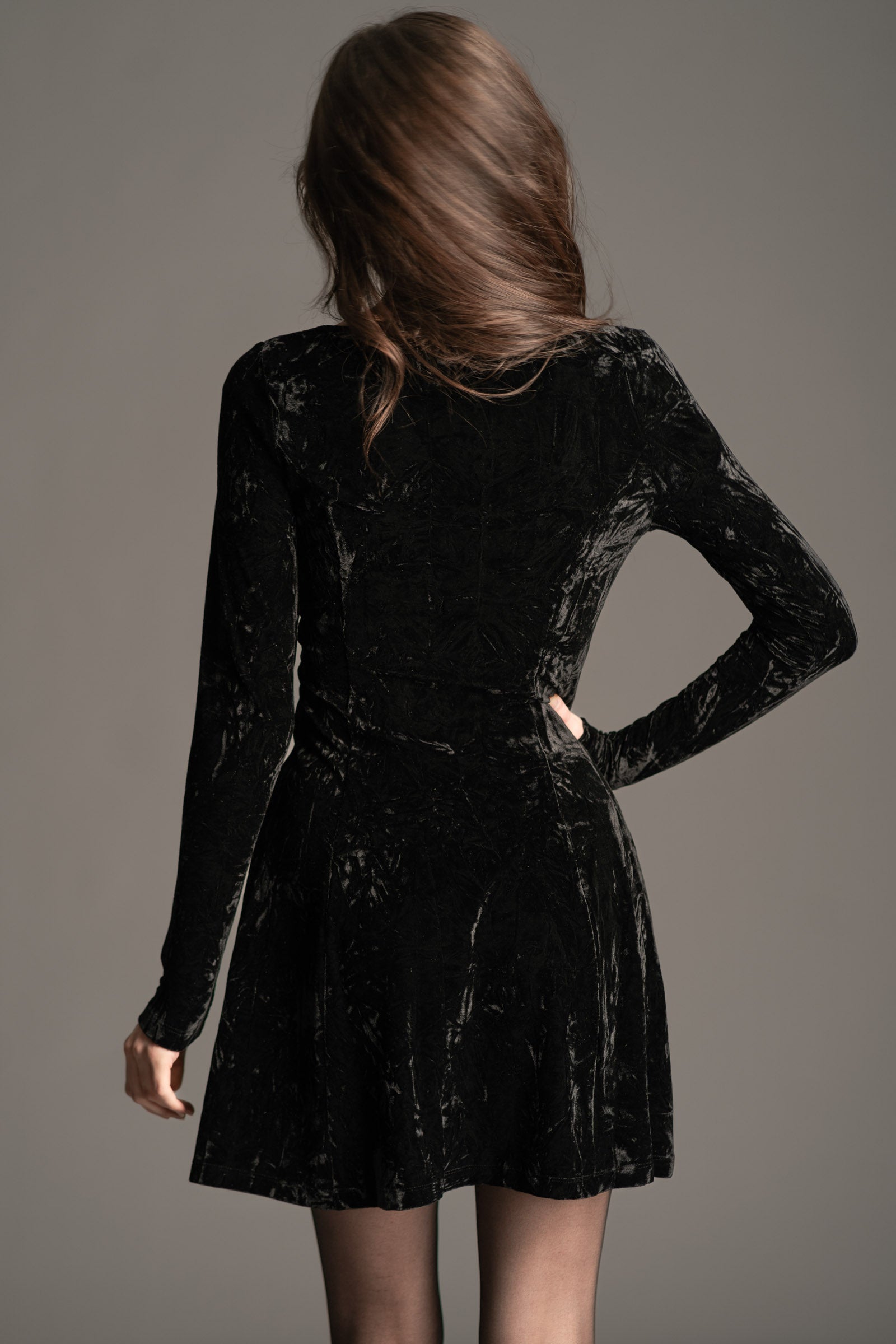 Little Lies Sweet Jane Black Crushed Velvet Mini Dress shown from the back, featuring long sleeves and a soft velvet texture.