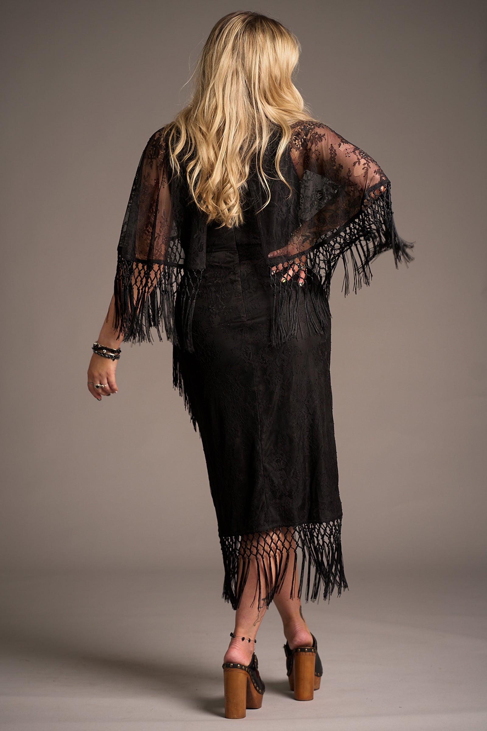 Erin showing the back of the Tango in the Night cape midi lace dress, Stevie Nicks inspired styling studio