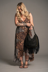 Model wearing Little Lies Willow Slouchy Black Faux Suede Studded Bag styled with the Zadie Animal Handkerchief Dress