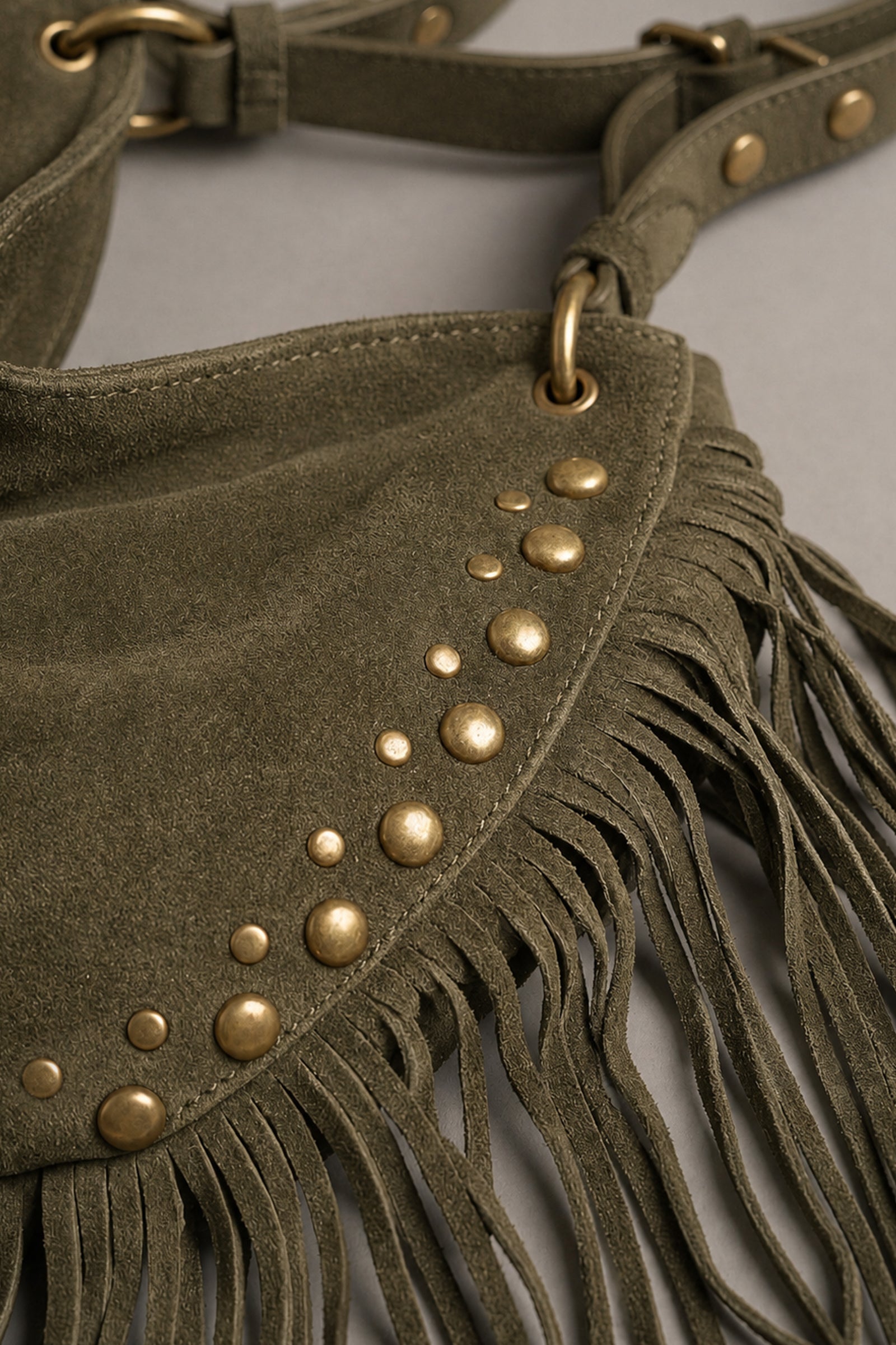 Close-up of Little Lies Willow khaki faux suede studded fringe shoulder bag detail