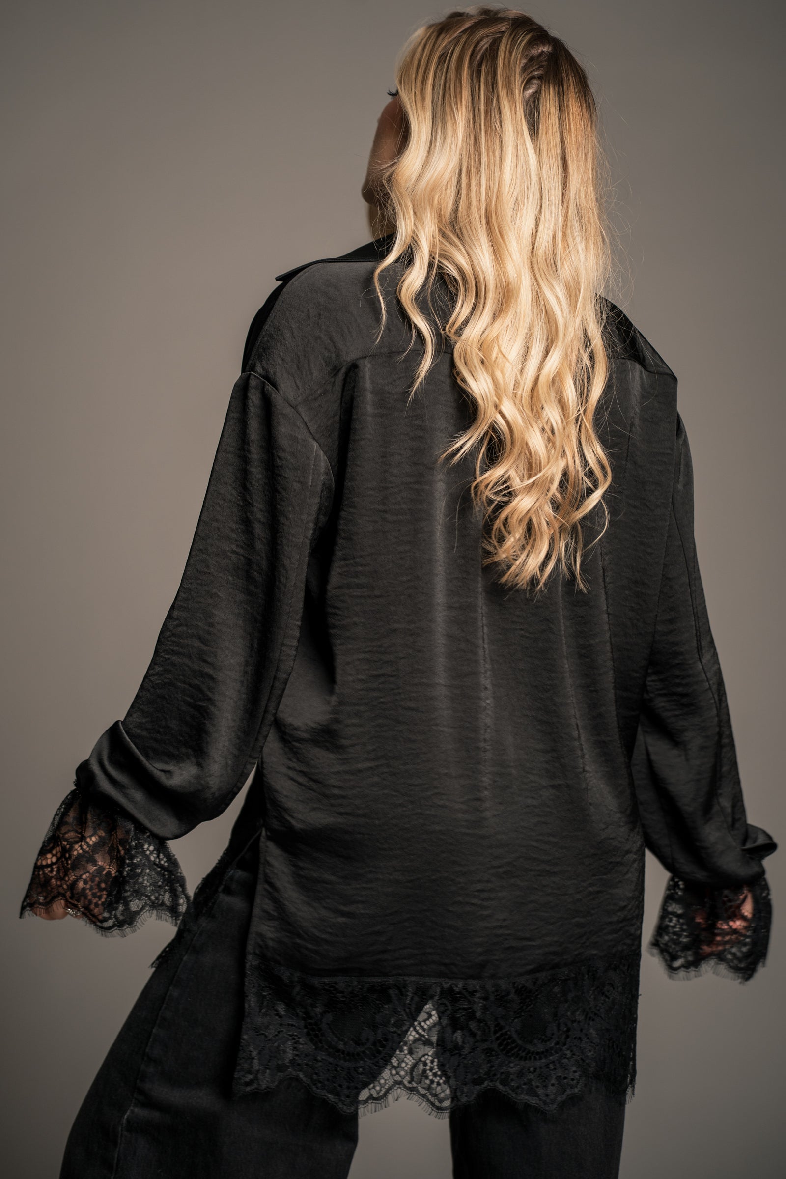 Erin wearing the Zoë Oversized Satin Shirt with lace cuffs — Little Lies