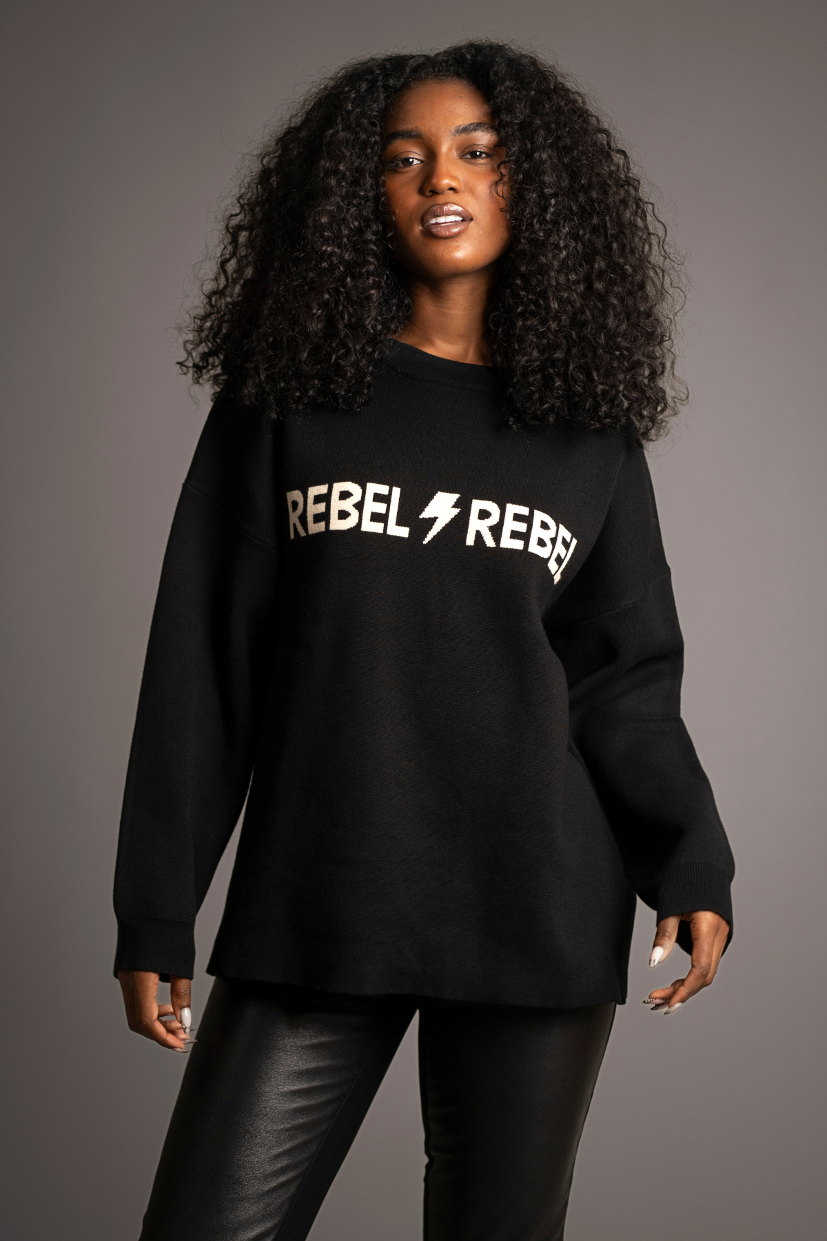 Mia Wearing Rebel Rebel Black Knit Jumper and Hendrix Black Faux Leather Flares