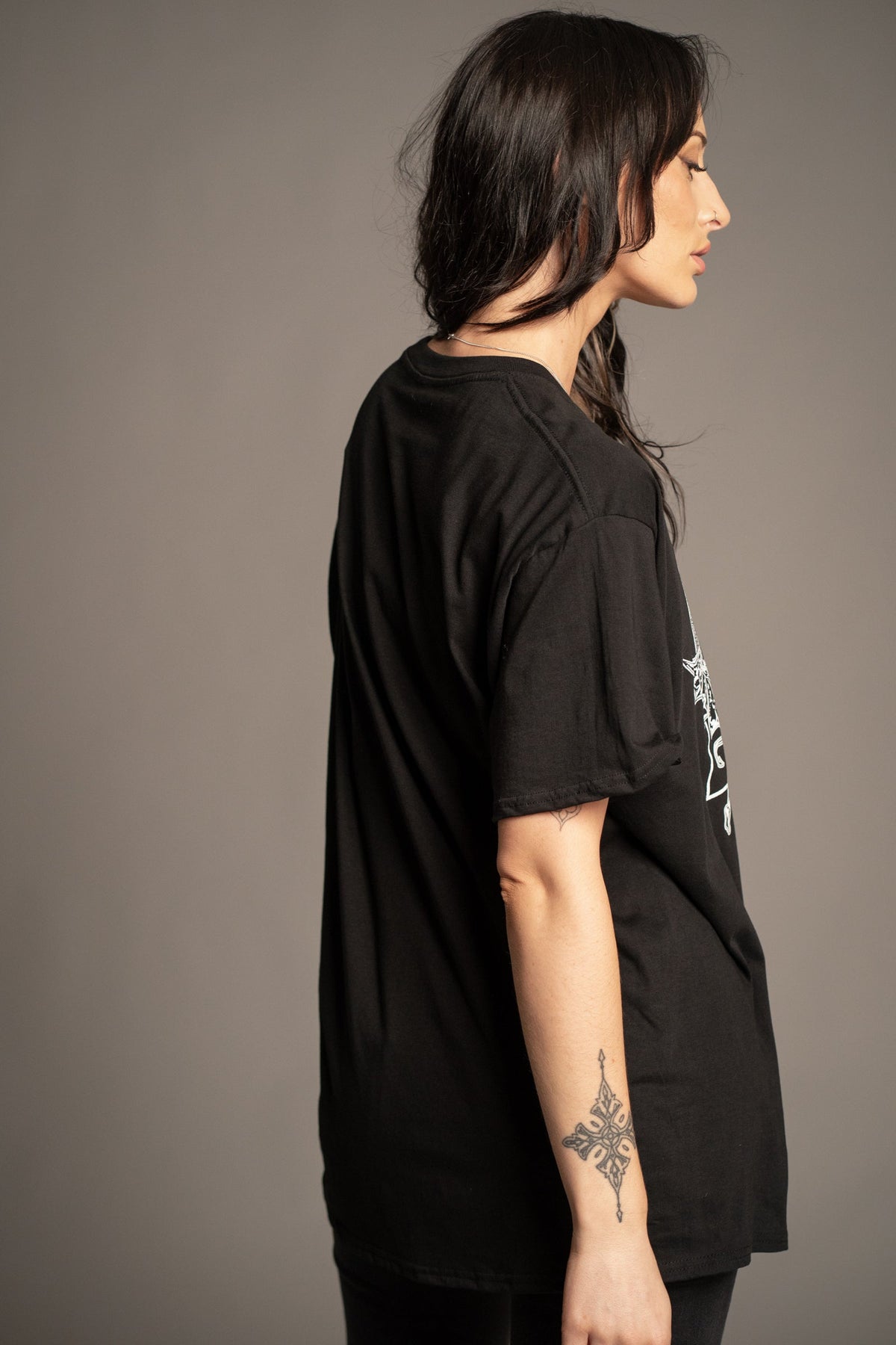 Back view of Victoria wearing the Black Sabbath vintage wash band T-shirt with relaxed oversized fit