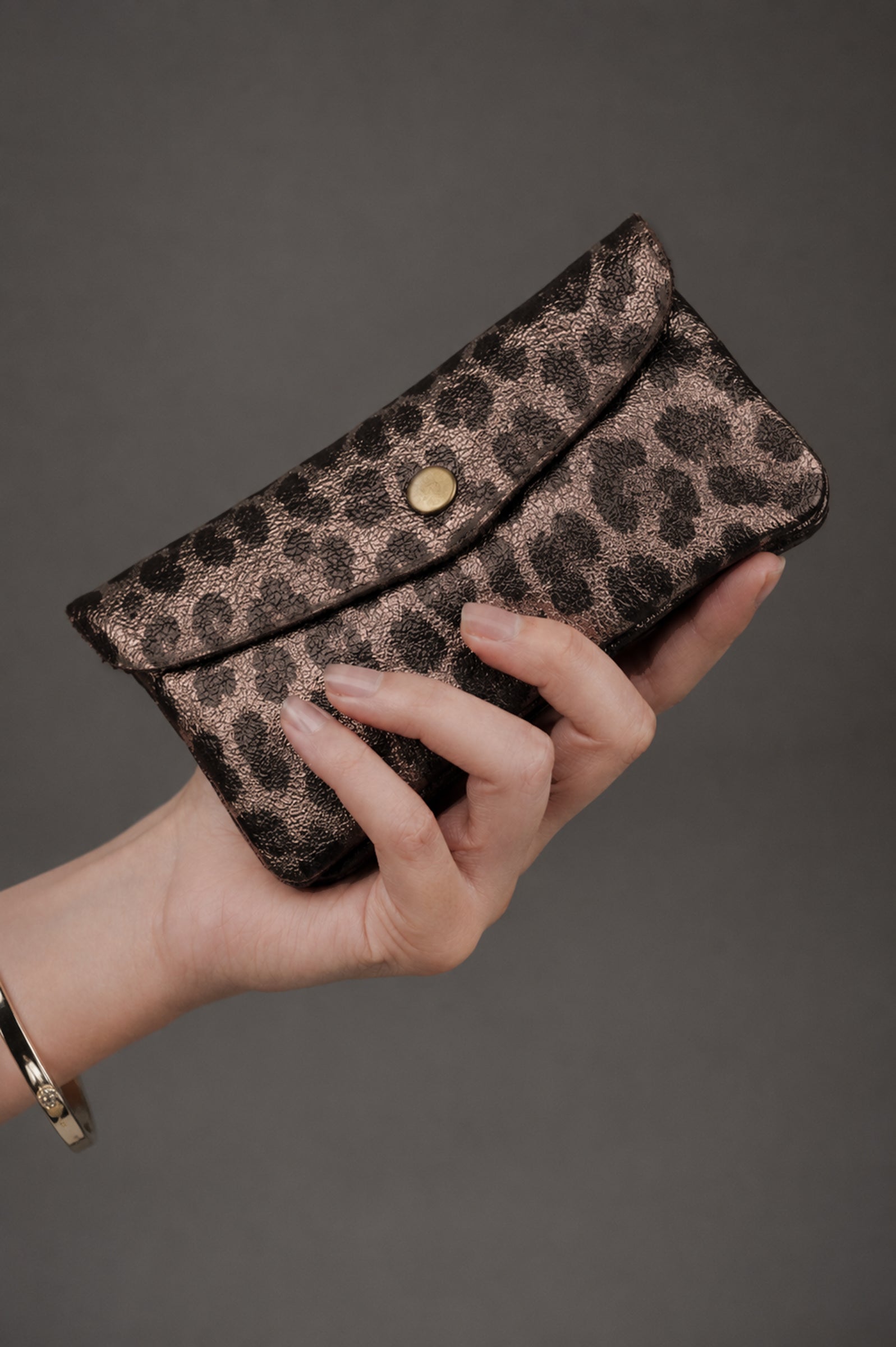 Front view of bronze metallic leopard suede coin purse