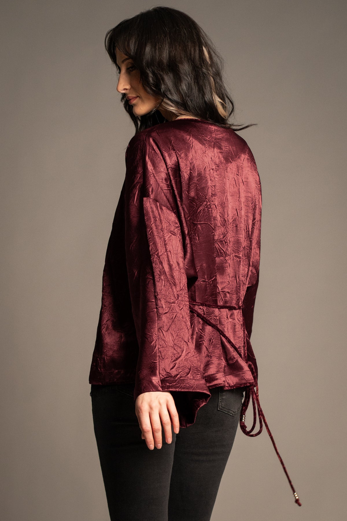 Celeste wine kimono top back view showcasing lustrous satin finish, relaxed silhouette and beaded tie-back detail