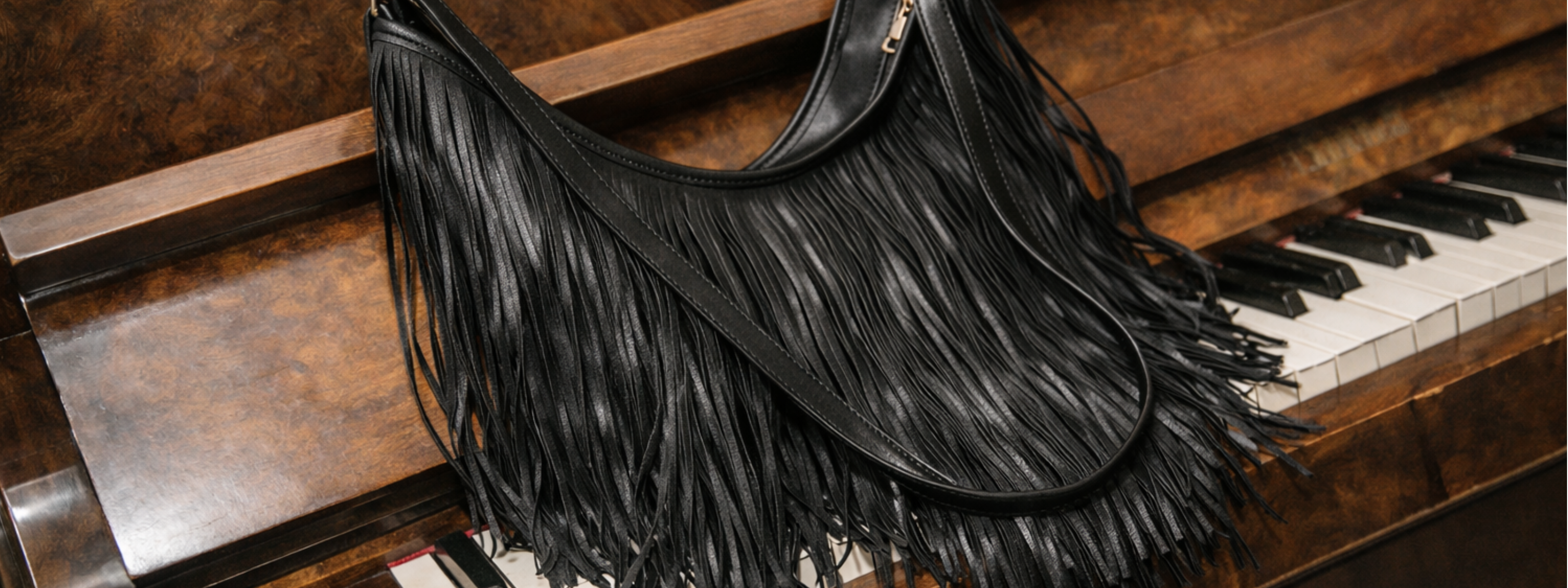 Little Lies Rhiannon Black Faux Leather Fringed shoulder bag with long fringe detailing and gold hardware