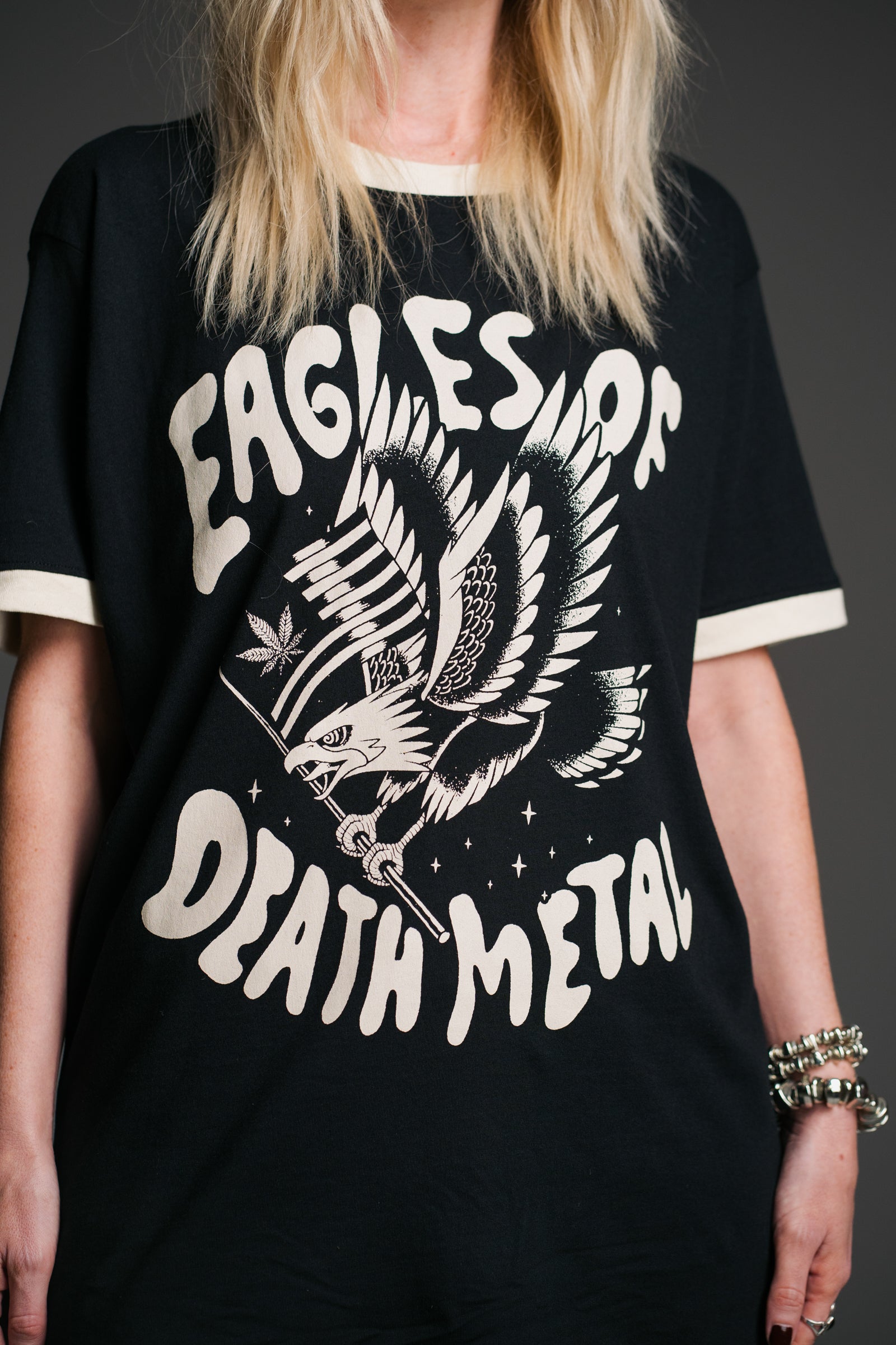 Close-up of the Eagles of Death Metal Ringer Band Tee showcasing the iconic eagle graphic artwork and retro contrast ringer detailing