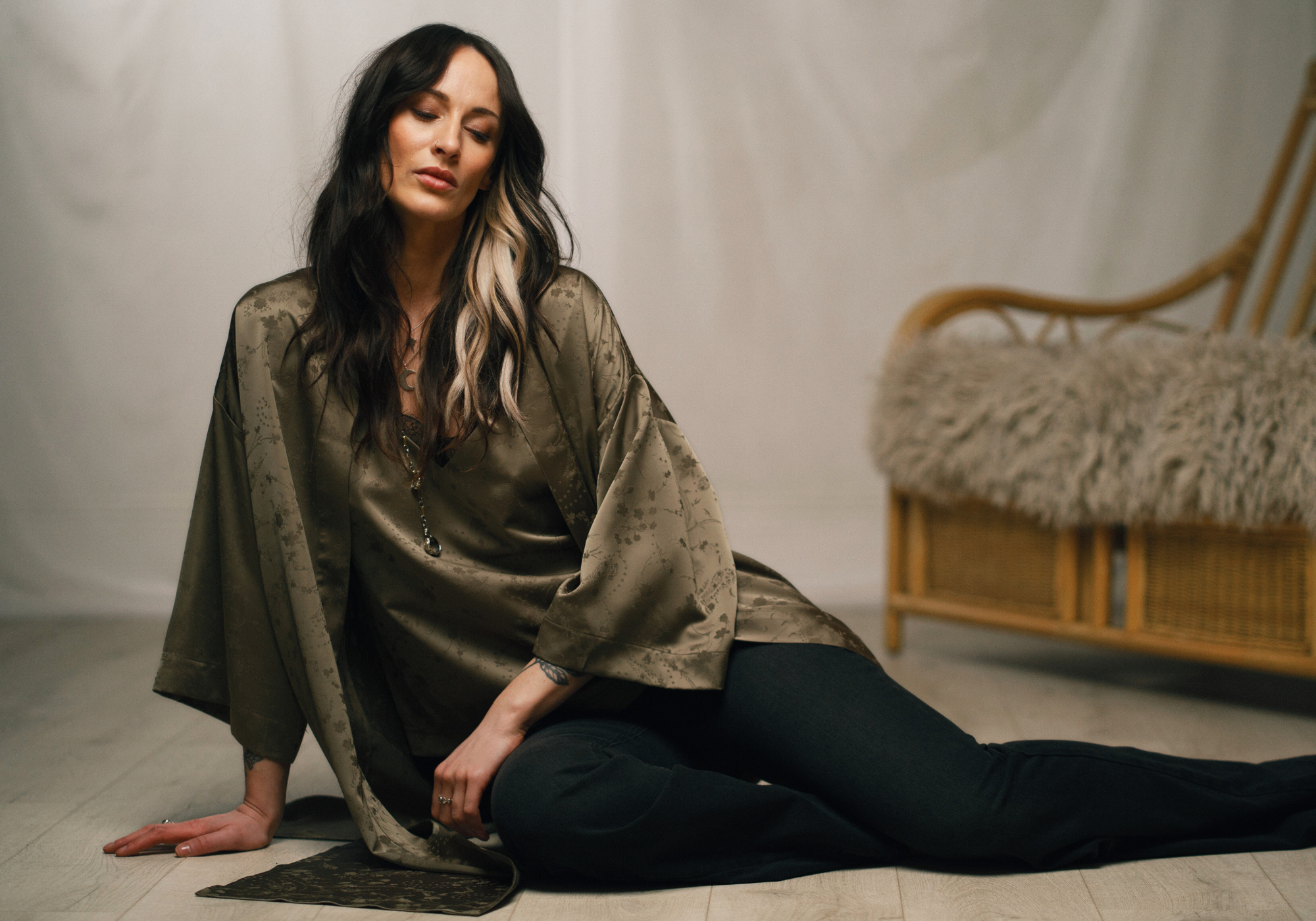 model wearing iris sage kimono and iris sage cami with lace detail styled with Hendrix Denim Flares.