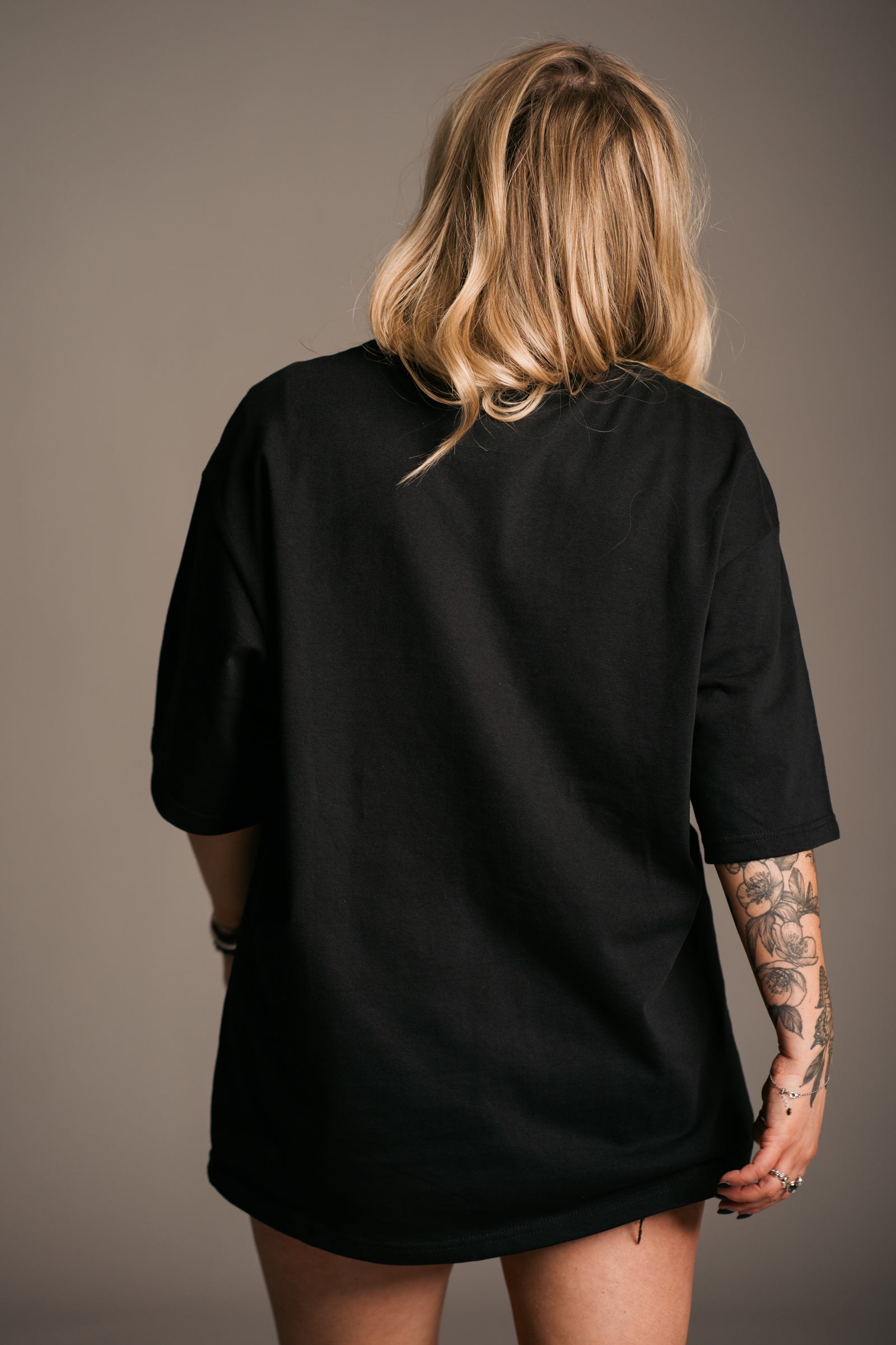 Plain black back view of Fleetwood Mac Floral Oversize Band Tee featuring licensed floral graphic artwork, an oversized fit and vintage-inspired rock styling
