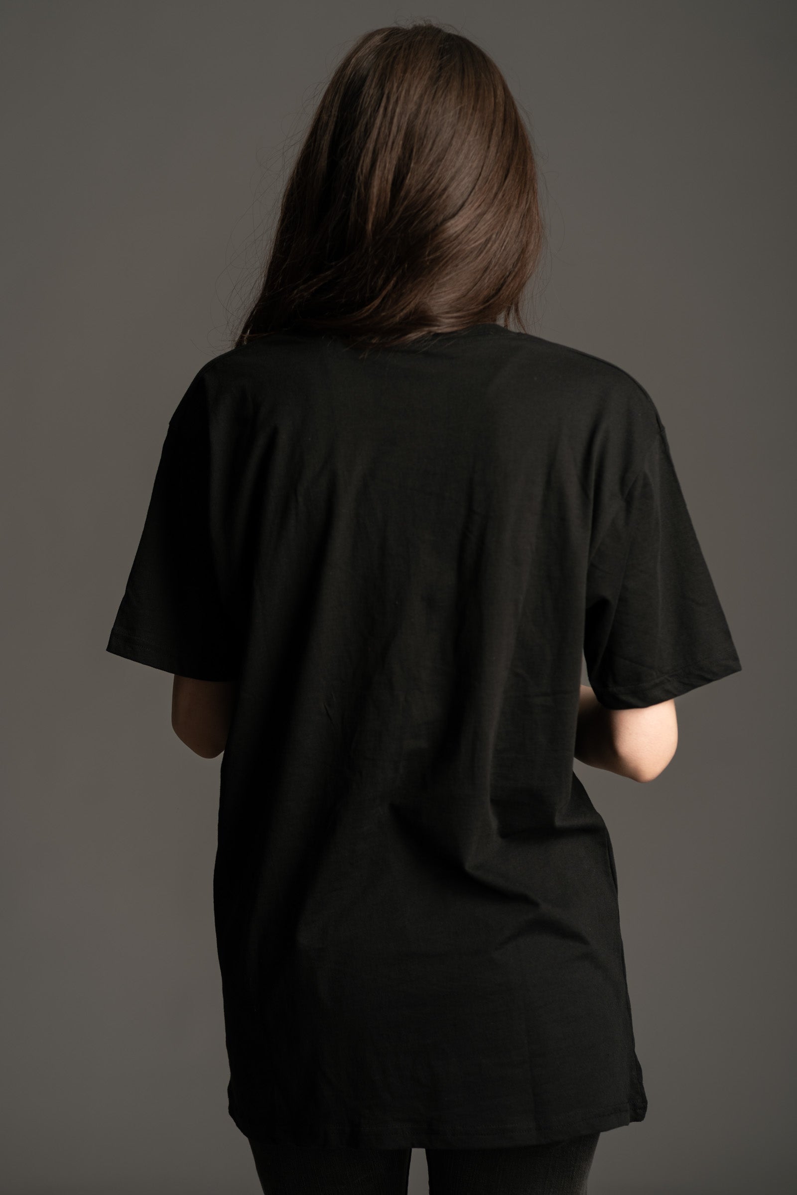 Plain black, back view of Little Lies Foreigner band tee