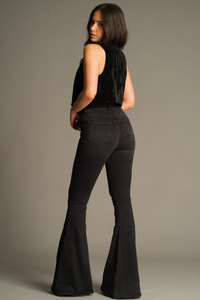 Back view of Hendrix Denim Flares in washed black with rear patch pockets, high-waisted fit and dramatic flare leg
