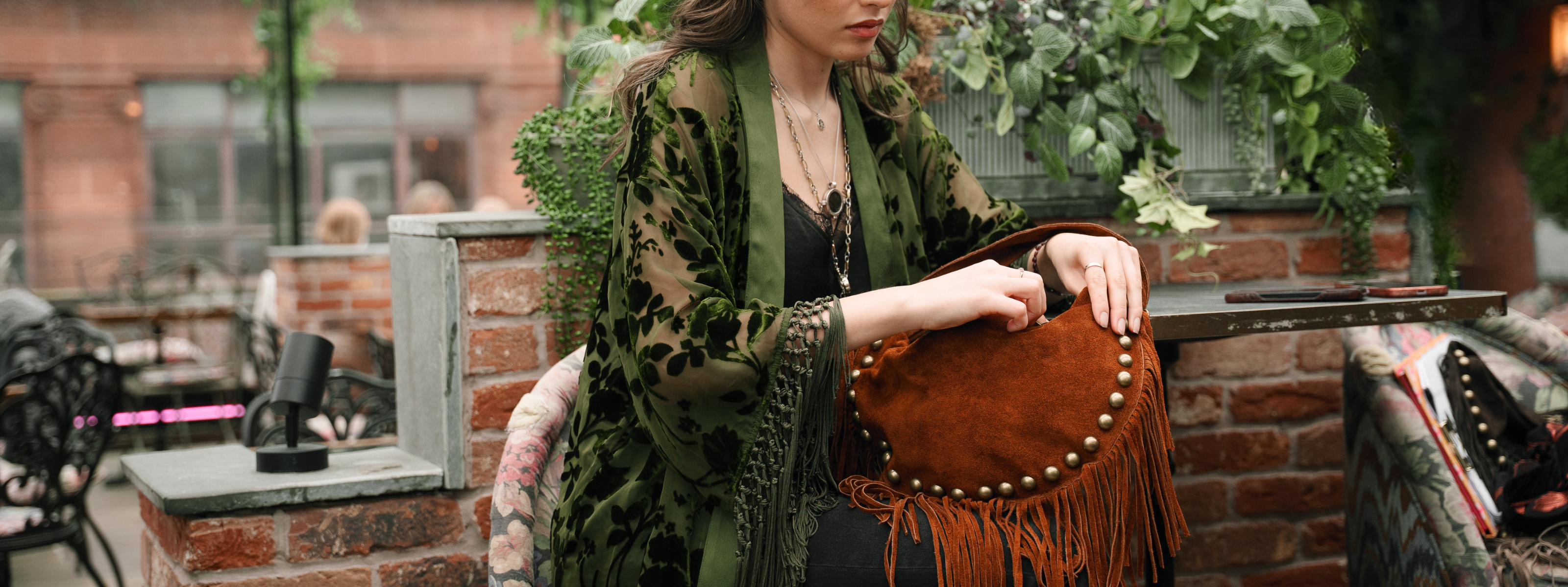 Dakota Olive Devore Kimono by Little Lies featuring velvet burnout detailing, fringe trim and a flowing bohemian silhouette styled with a tan suede fringe bag