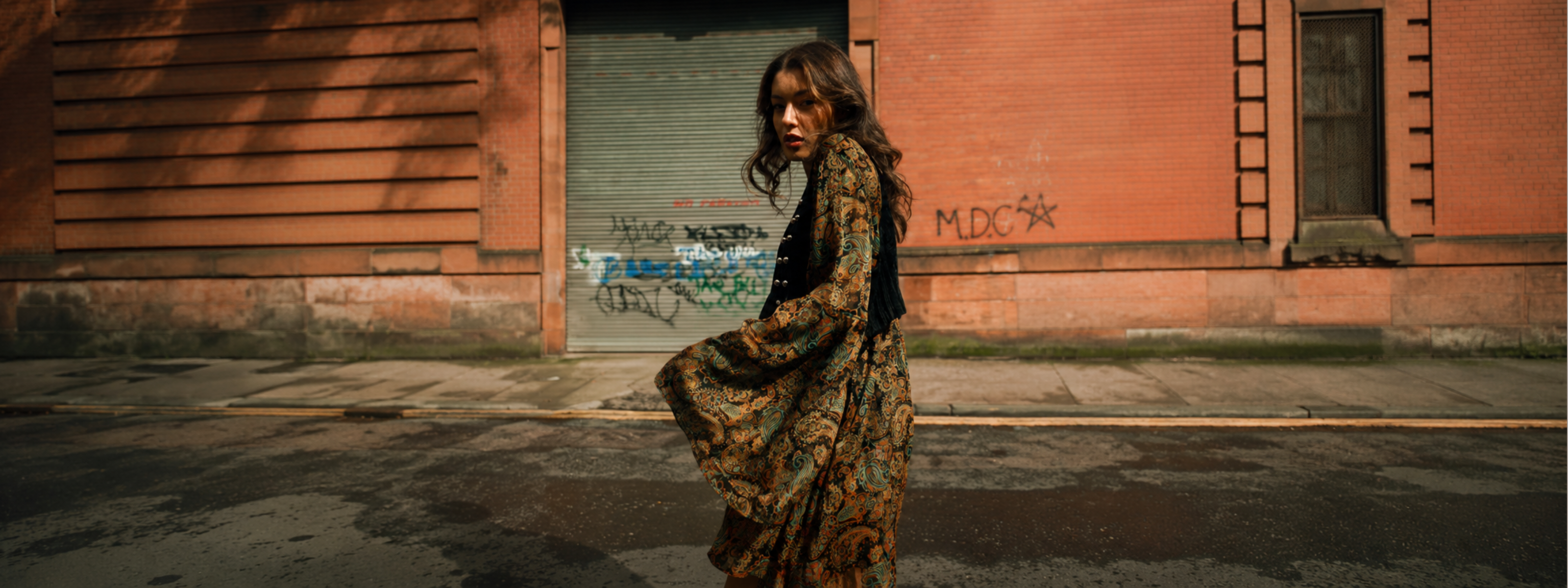 Bronwyn wearing the Ringo Paisley Smock Dress styled with black velvet waistcoat, Glasgow street style