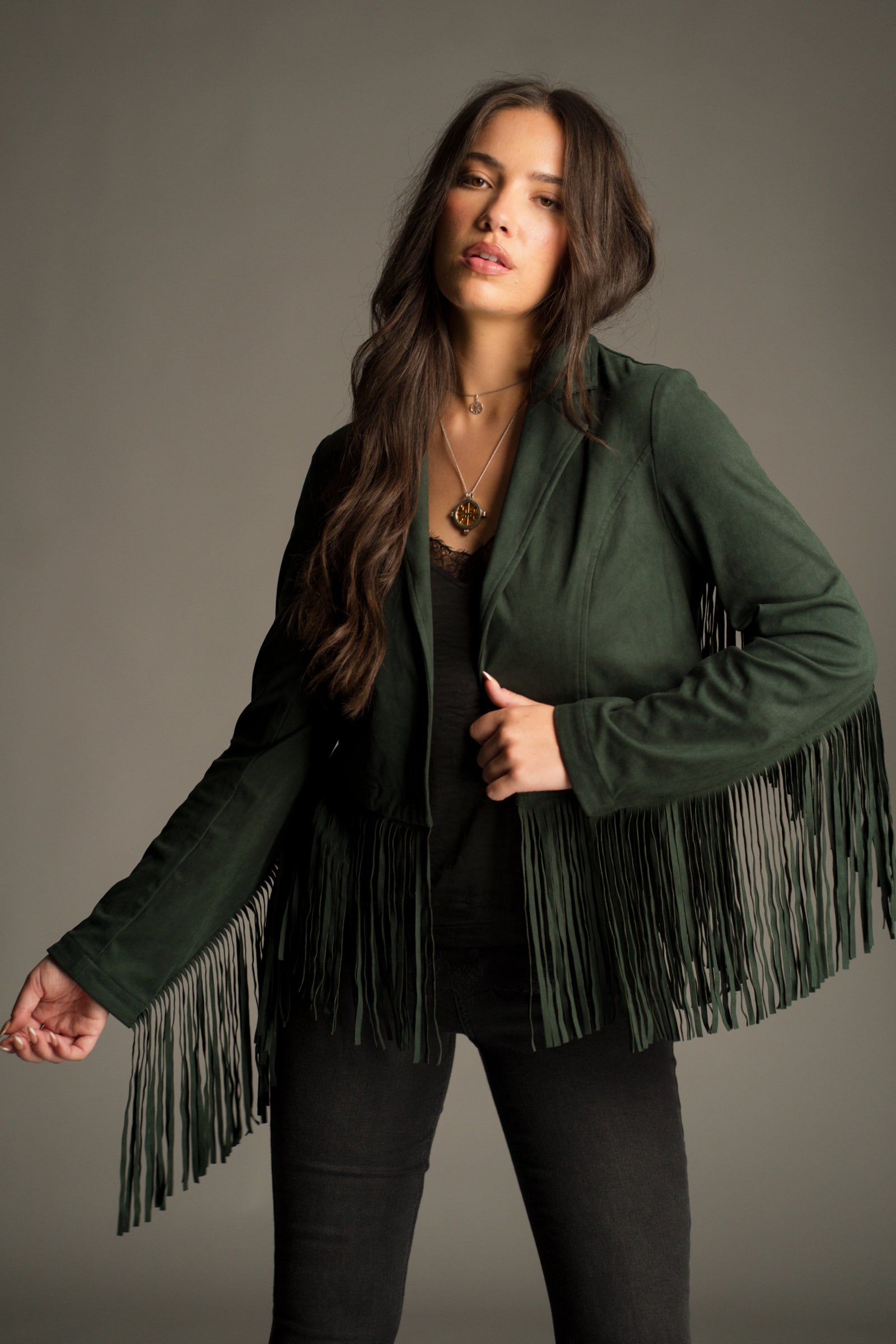 Ivy Emerald Green Fringed Faux Suede Jacket styled with a Nightbird Black Cami Top and Hendrix Flares.