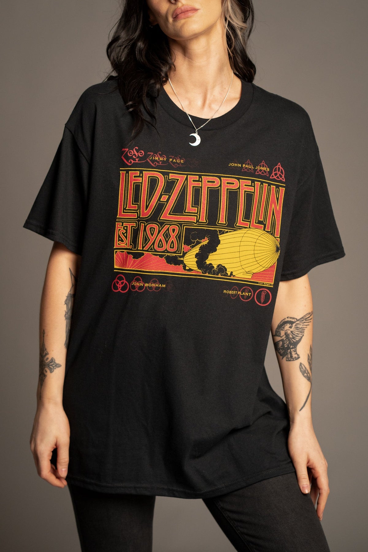 Close-up of Victoria wearing the Led Zeppelin 1968 band T-shirt with red and yellow Zephyr artwork