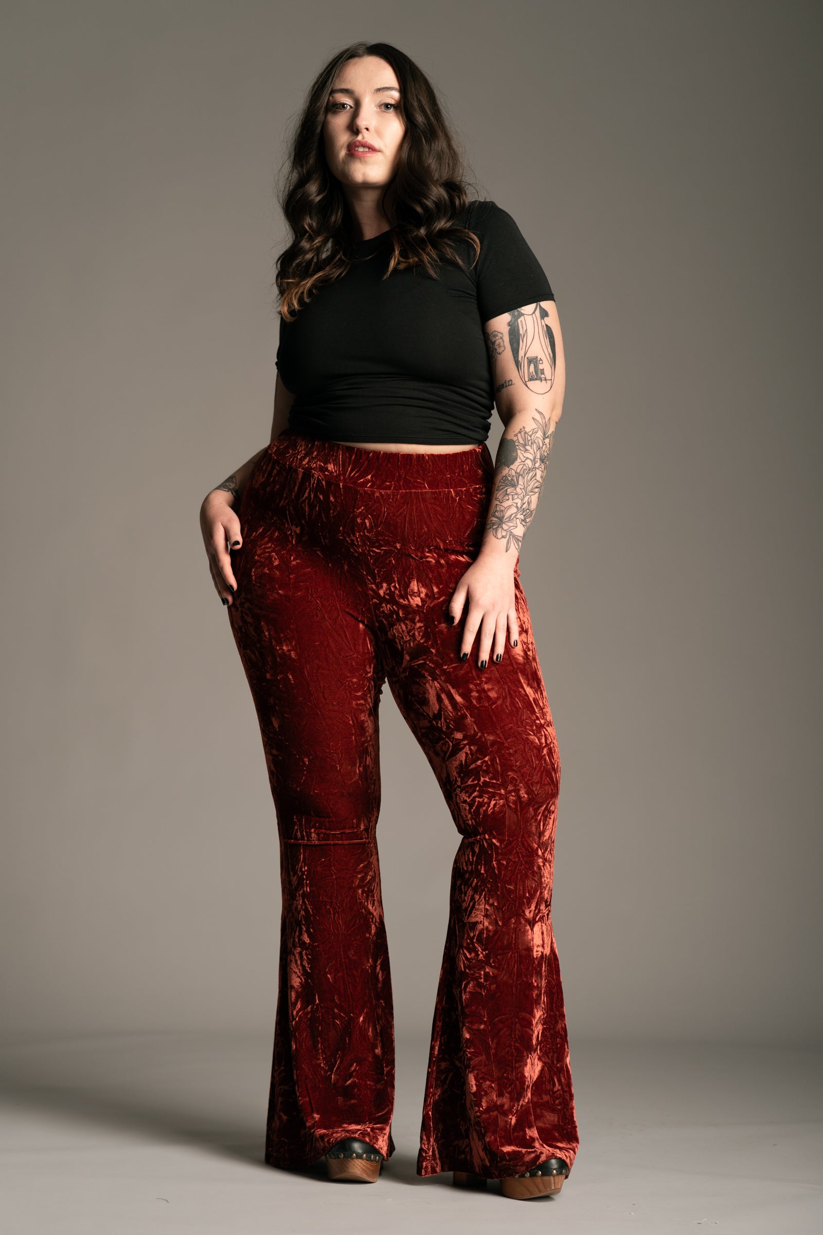 Plus size Hendrix Rust Crushed Velvet Flares front view in rich burnt rust, high-waist silhouette