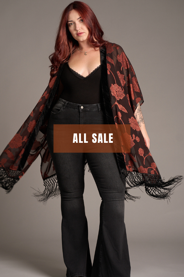 Shop Summer Sale at Little Lies with up to 60% off. Model wearing Venus Fringed Kimono and Hendrix Denim Flares