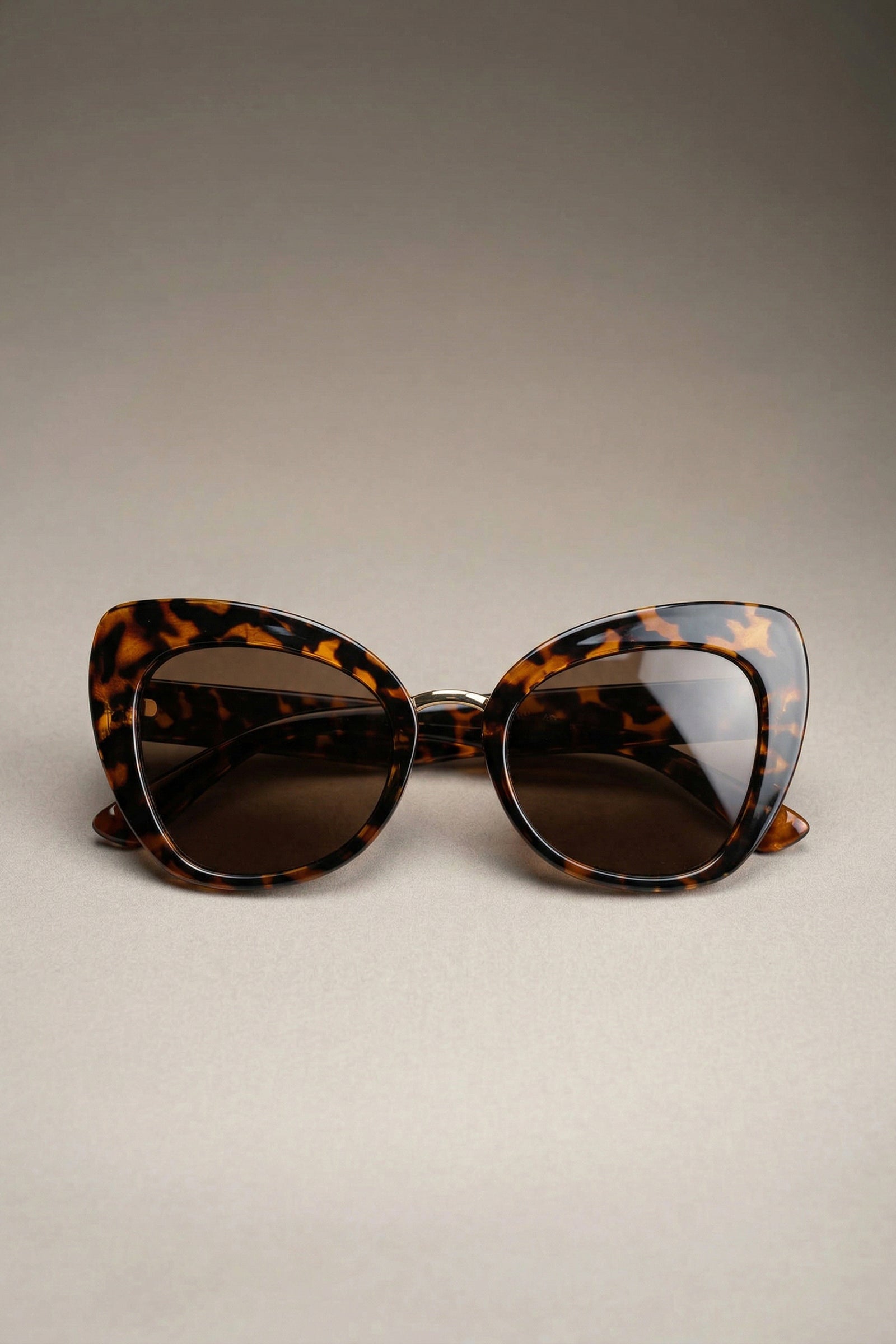 Tortoiseshell cat eye sunglasses folded showing frame shape
