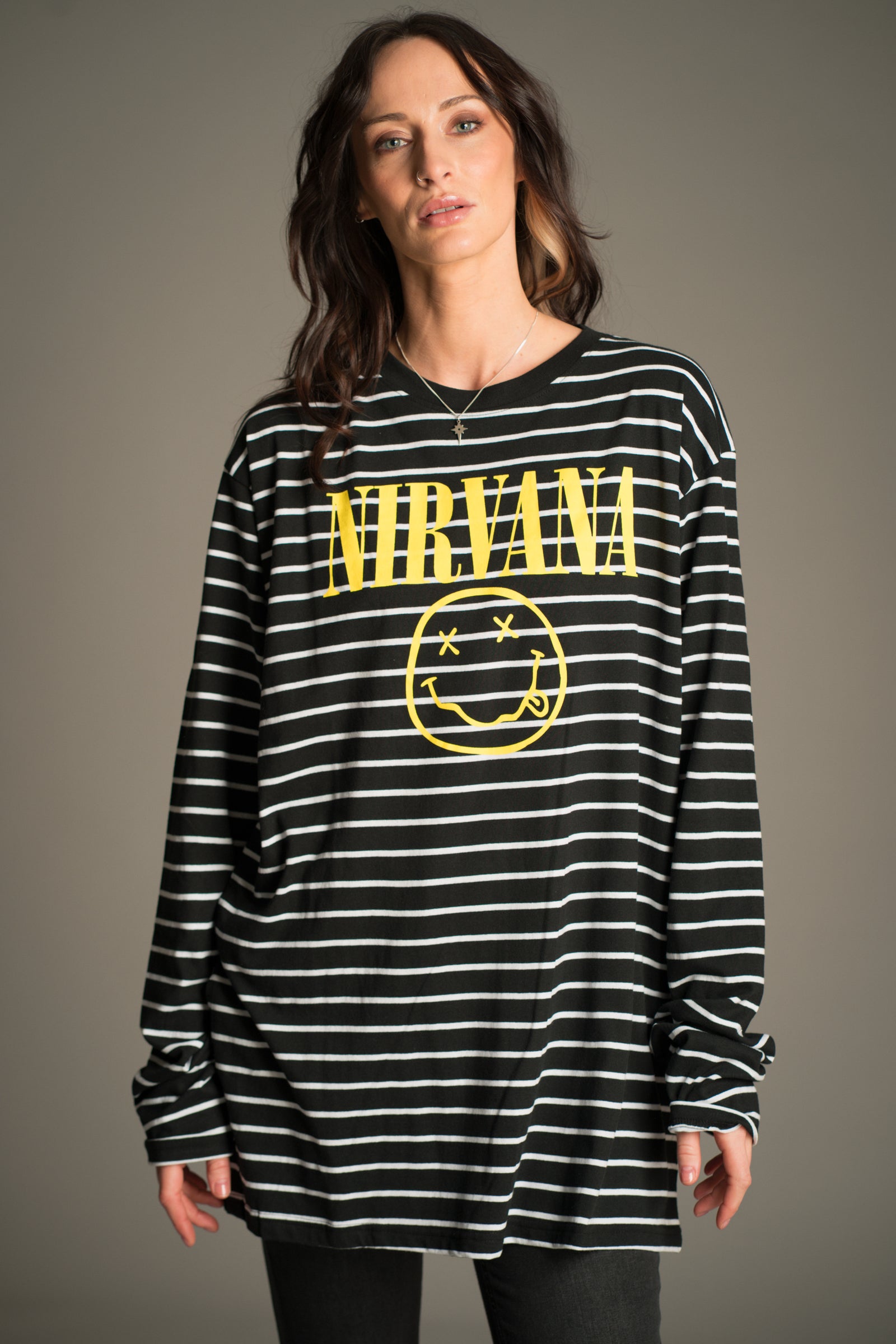 Nirvana striped long sleeve T-shirt with smiley logo front view styled with Hendrix Denim Flares.