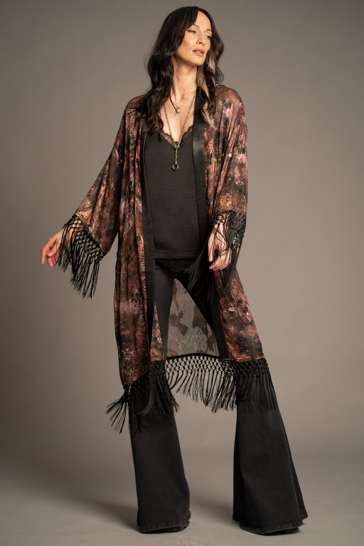Practical Magic kimono front view featuring an antique floral print, flowing silhouette and statement fringe hem