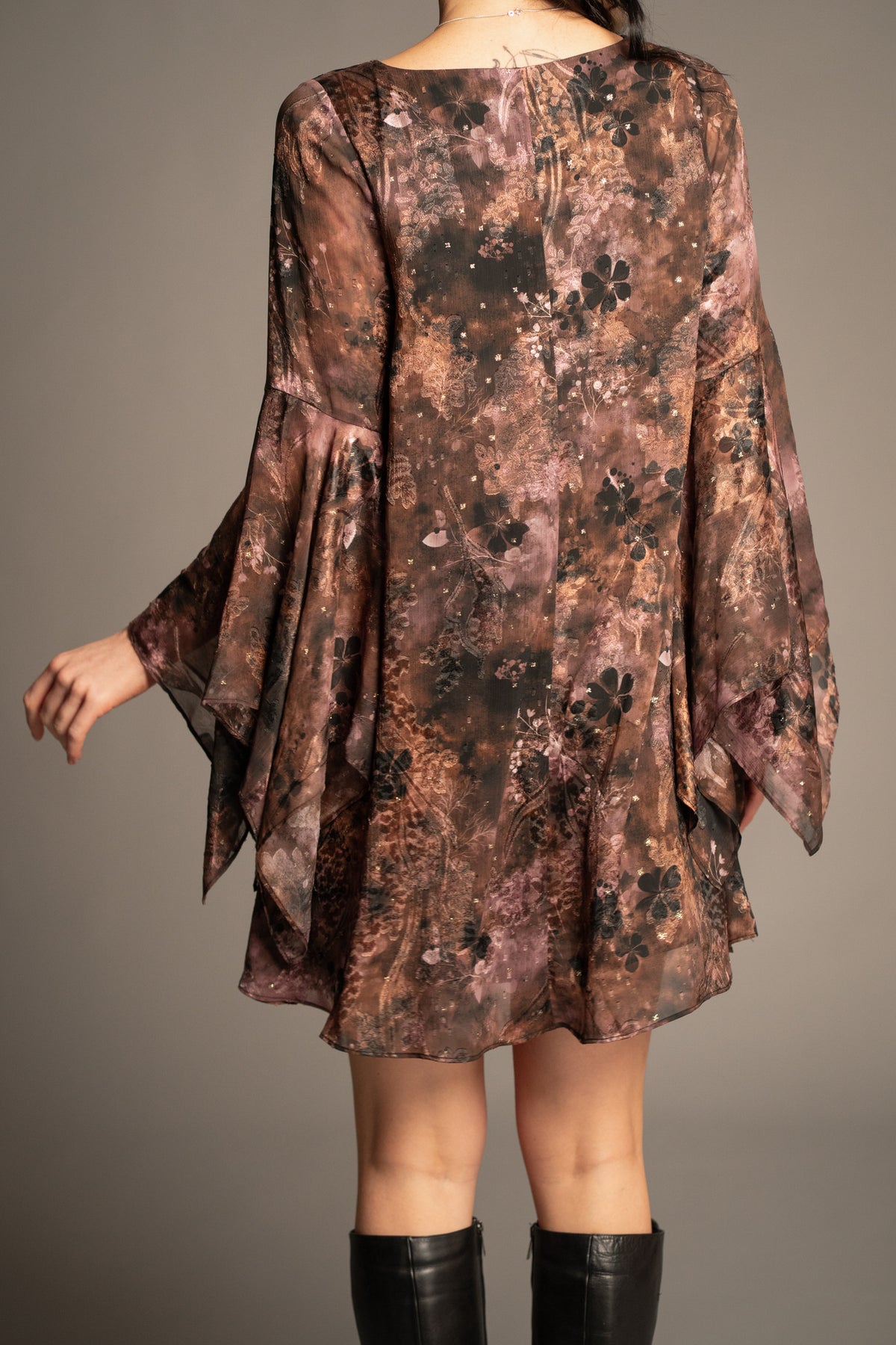 Practical Magic mini dress back view with floaty swing silhouette, floral print and layered hanky sleeves