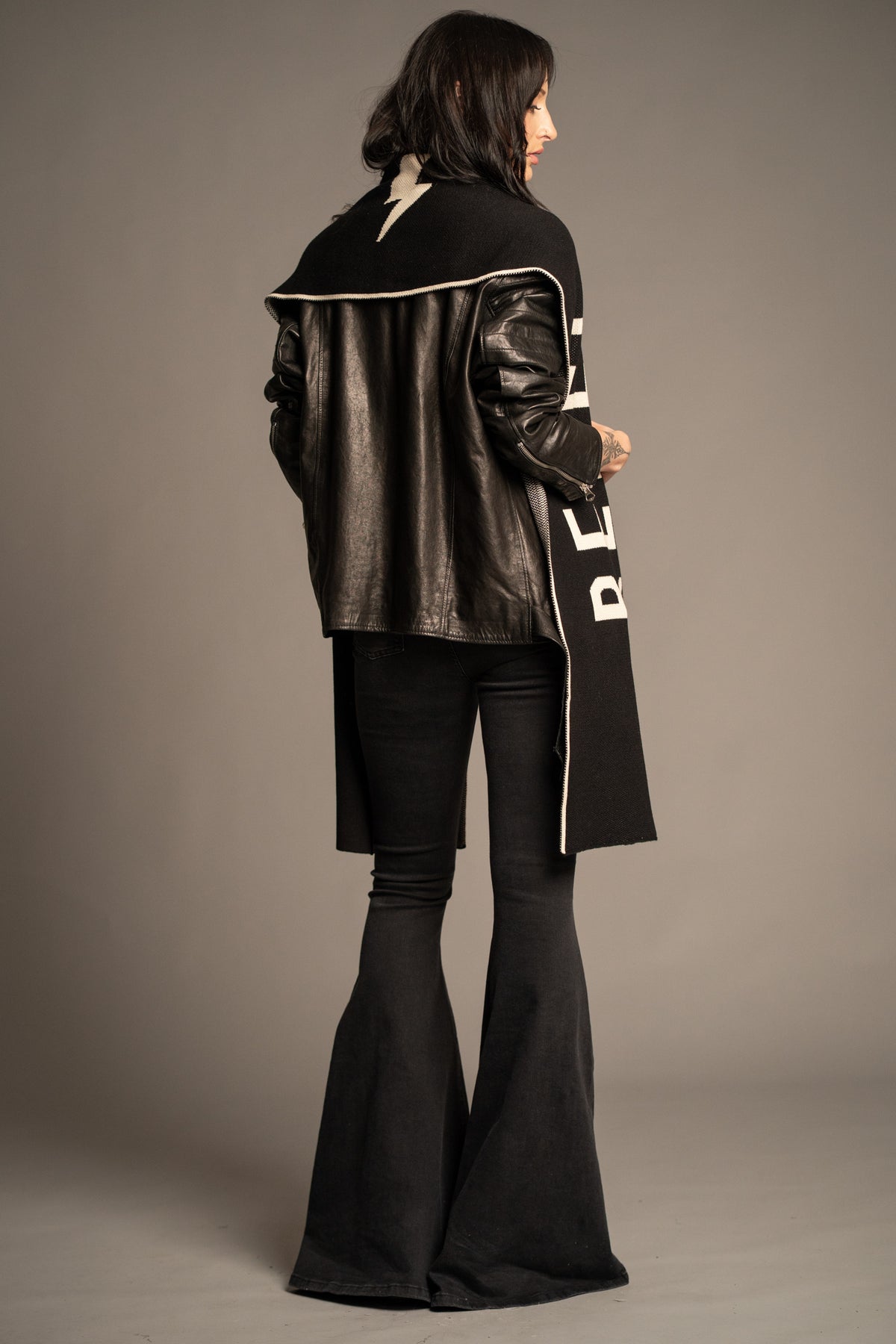 Rear view of black Rebel Rebel Knit Scarf featuring signature lightning bolt motif and contrast trim