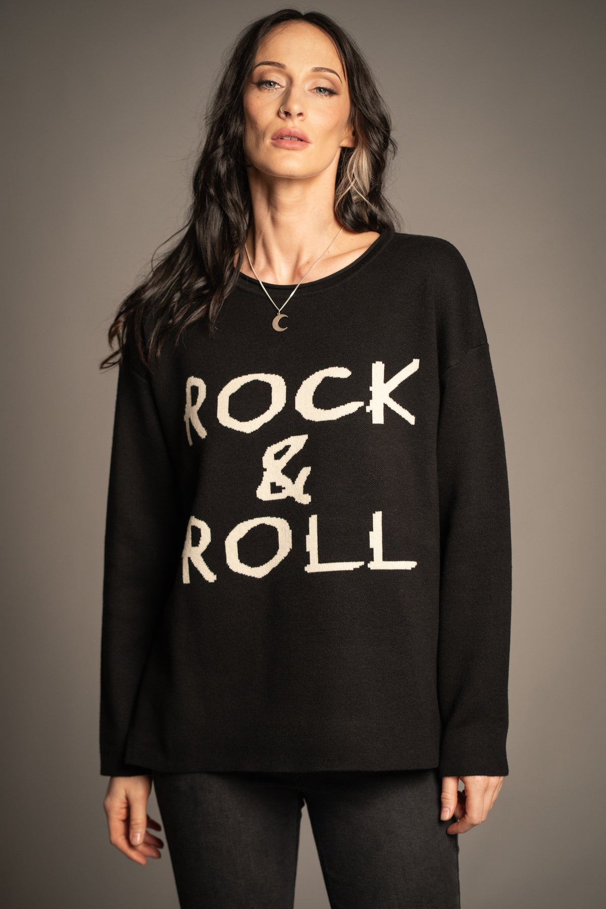 Detail view of the Rock & Roll Knit Jumper highlighting oversized ivory slogan lettering and soft knit fabric