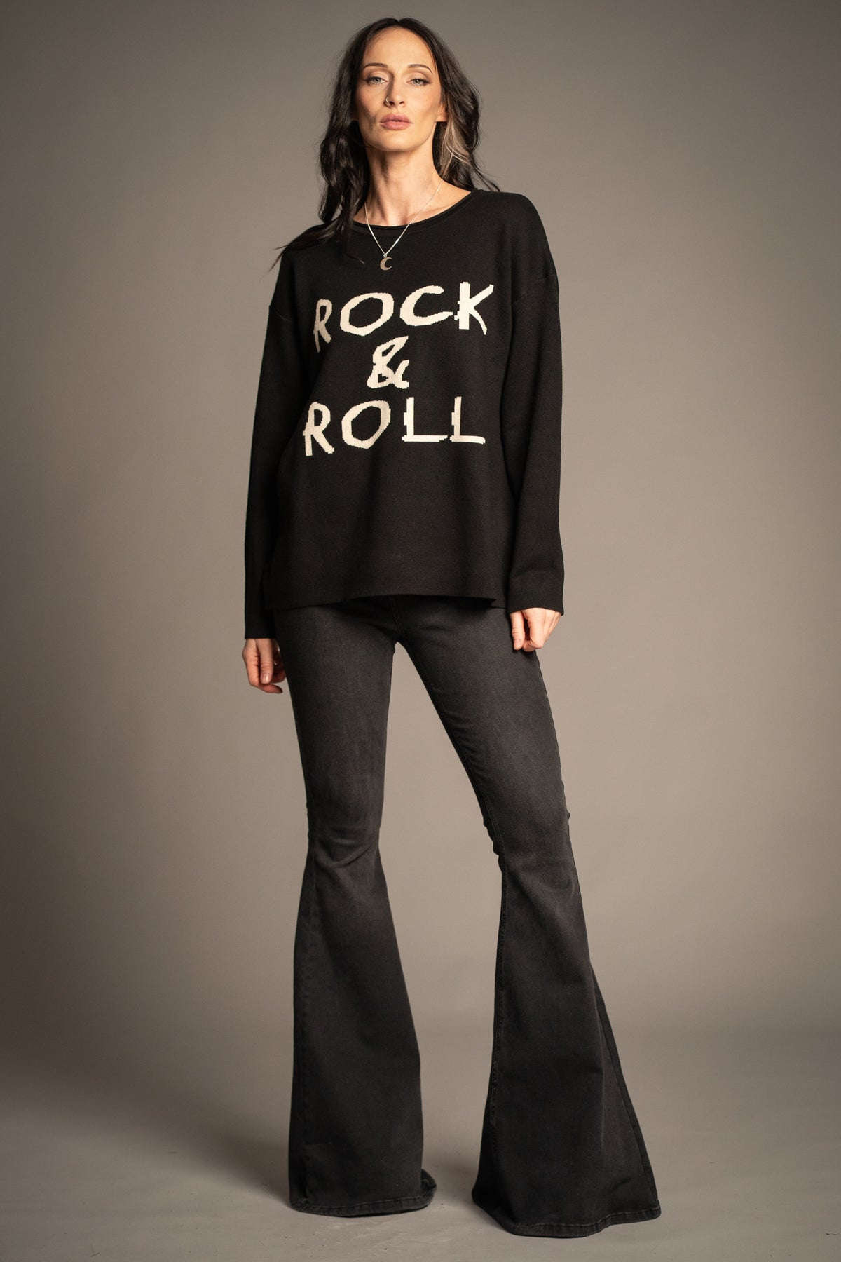 Little Lies Rock & Roll Knit Jumper in black featuring oversized ivory Rock & Roll slogan lettering and a relaxed fit