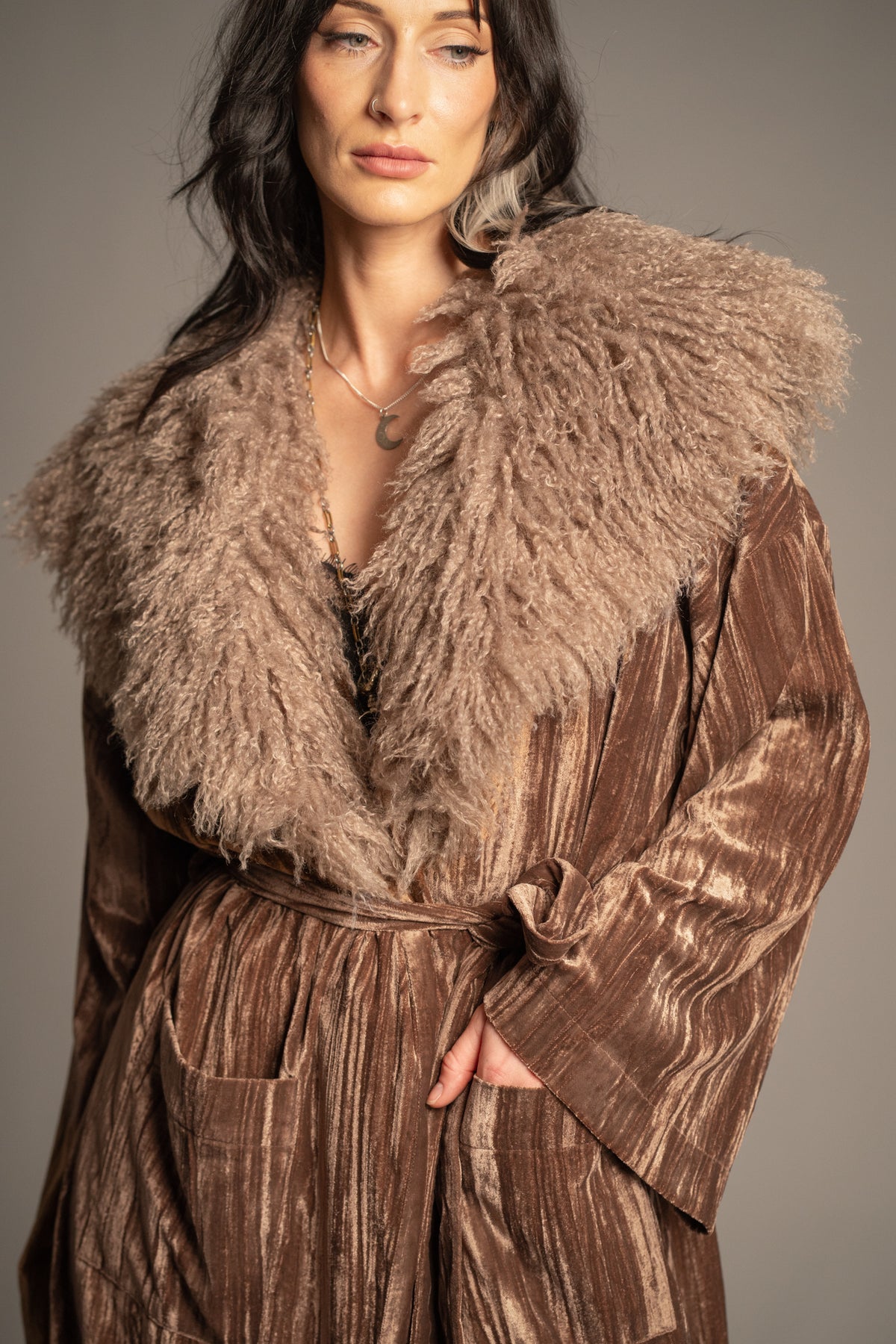Close-up of Sienna velvet kimono jacket showcasing oversized faux fur collar and textured bronze velvet fabric