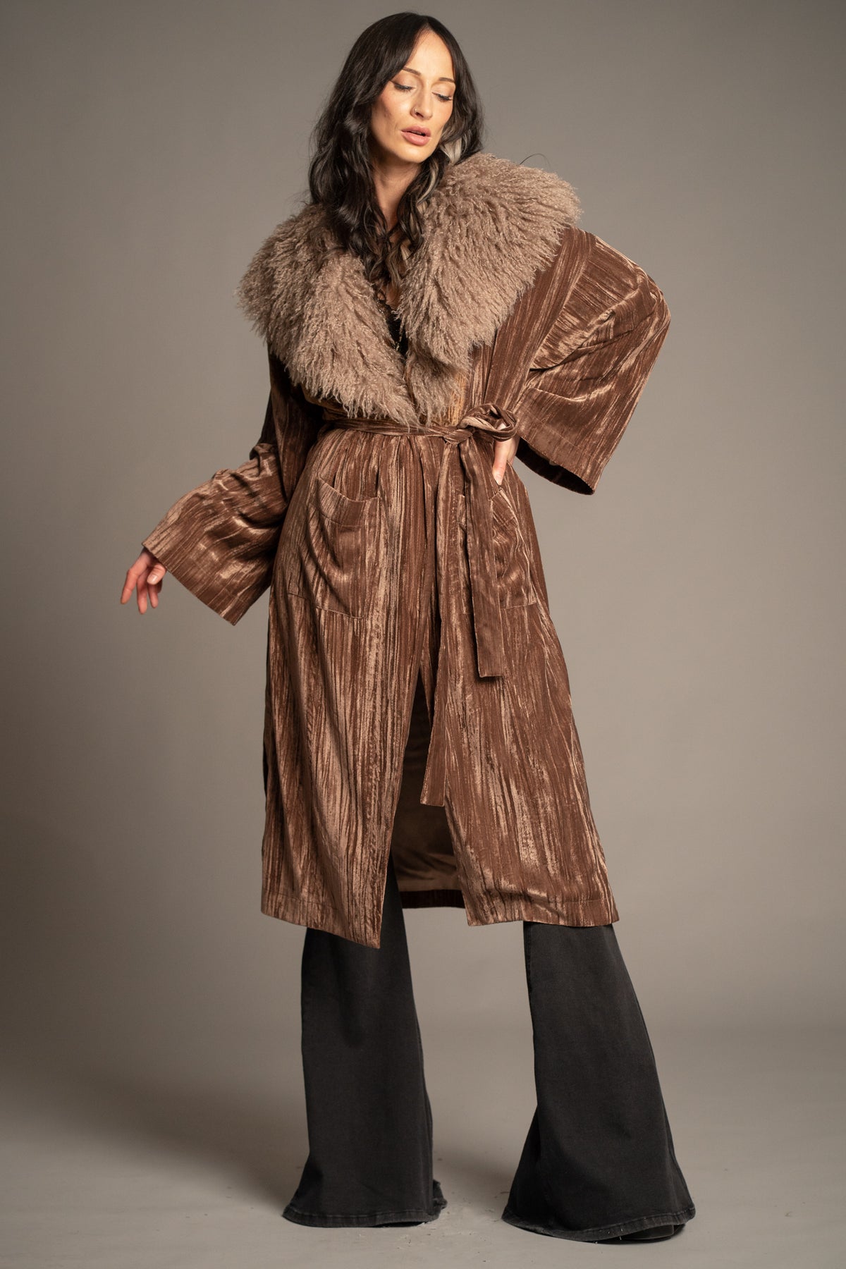 Sienna bronze velvet kimono jacket worn closed with tie waist belt, oversized faux fur collar and patch pockets