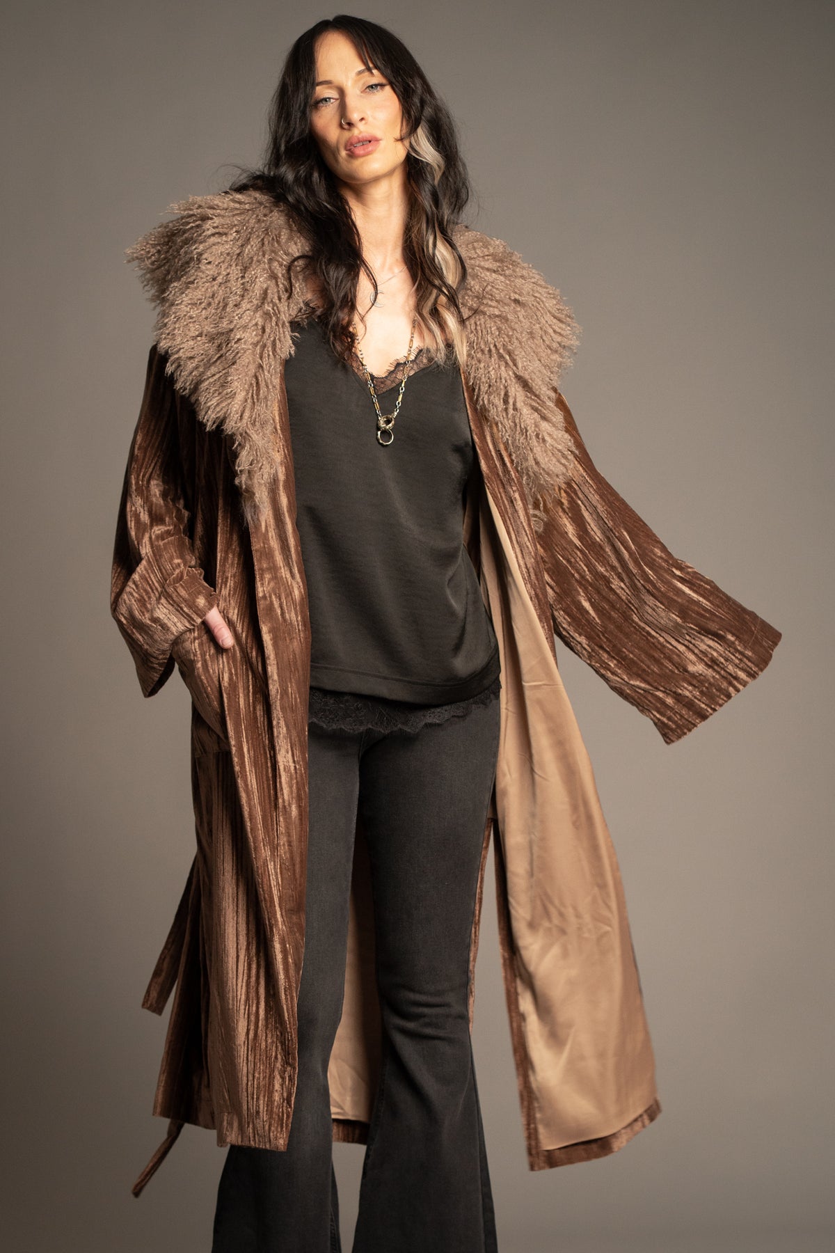 Sienna bronze velvet kimono jacket worn open with a faux fur collar, wide sleeves and relaxed bohemian silhouette