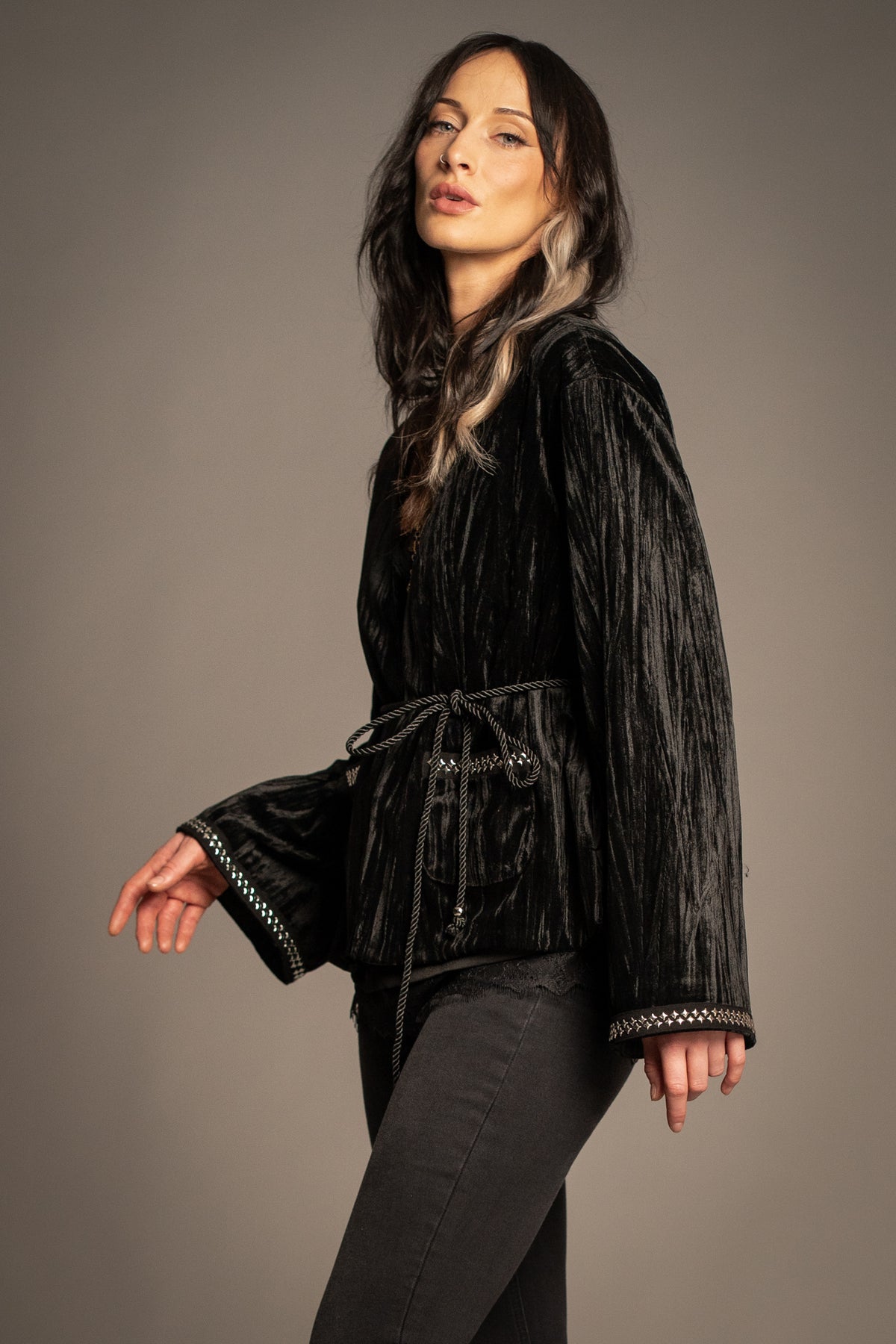Silver Springs studded velvet jacket side view with silver stud embellishment, tie-back waist and flared sleeves