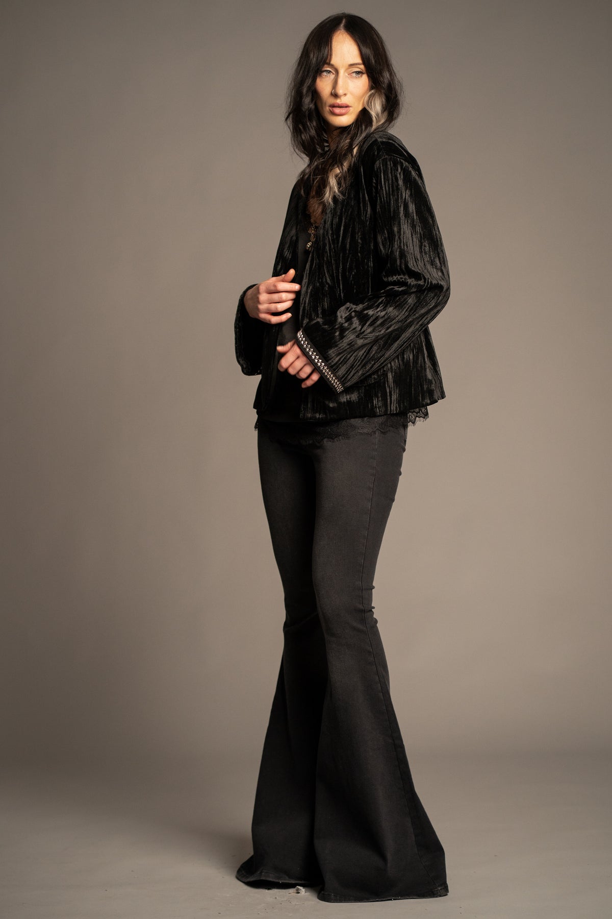 Silver Springs studded velvet jacket side view with silver stud embellishment, tie-back waist and flared sleeves