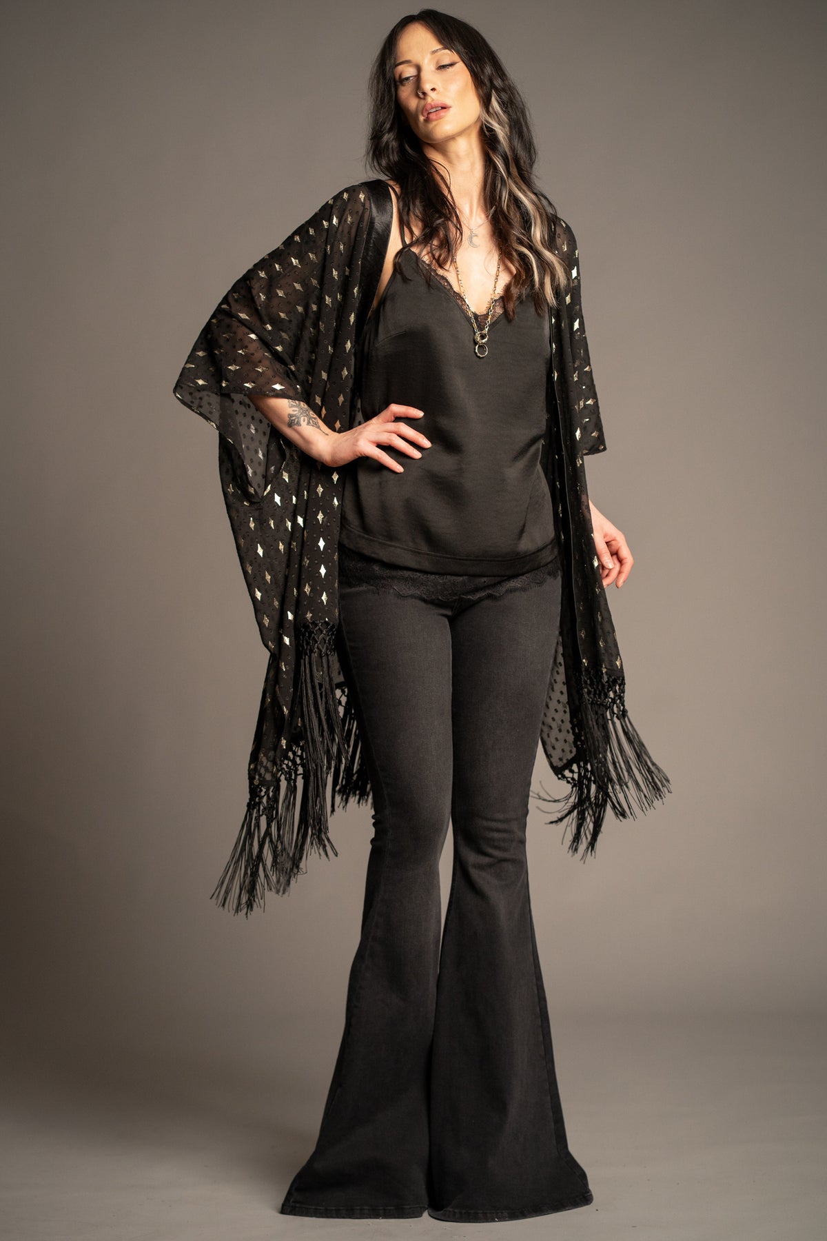 Songbird black metallic kimono with gold foil star print, tassel fringe hem and flowing open-front silhouette front view