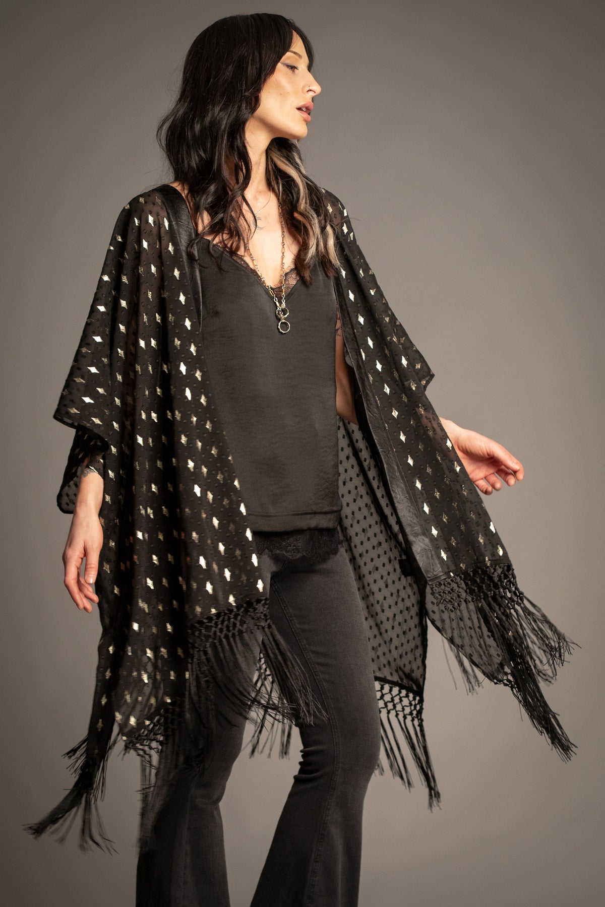 Songbird black metallic kimono with gold foil star print, tassel fringe hem and flowing open-front silhouette front view