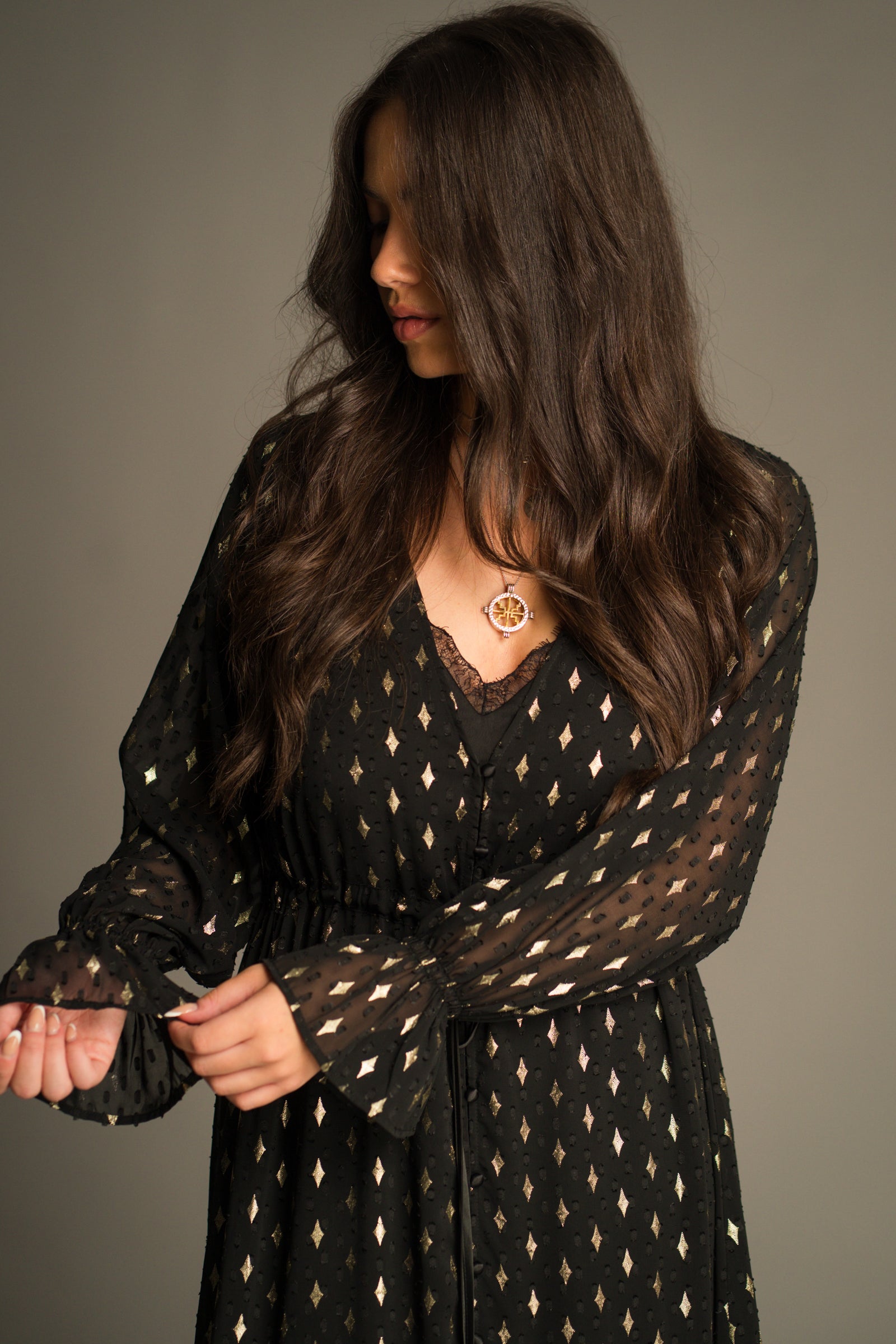Close-up of the Space Oddity Metallic Maxi Dress highlighting the sheer fabric, metallic gold foil print, drawstring waist and romantic bohemian styling