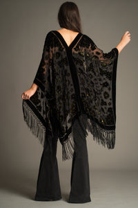 Back view of the Suzi Skull Black Devore Kimono showcasing the sheer devore fabric, velvet skull detailing, celestial motifs and dramatic fringe hem