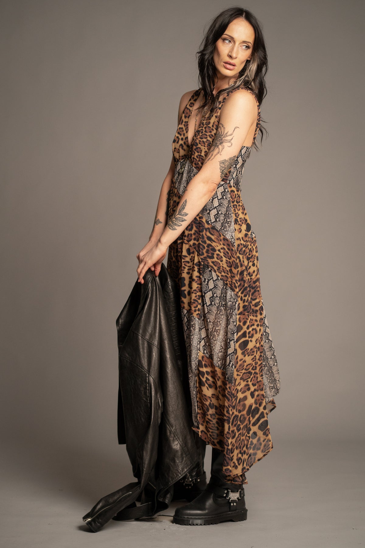 Little Lies Zadie Animal Handkerchief Dress side view showcasing mixed animal print design, flowing silhouette and handkerchief hem detail