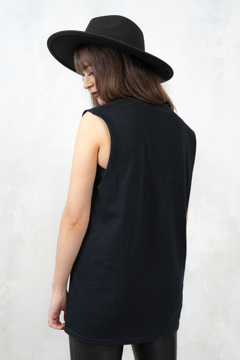 Model wearing Metallica Heartbreaker Vest, a black metallica band tee vest