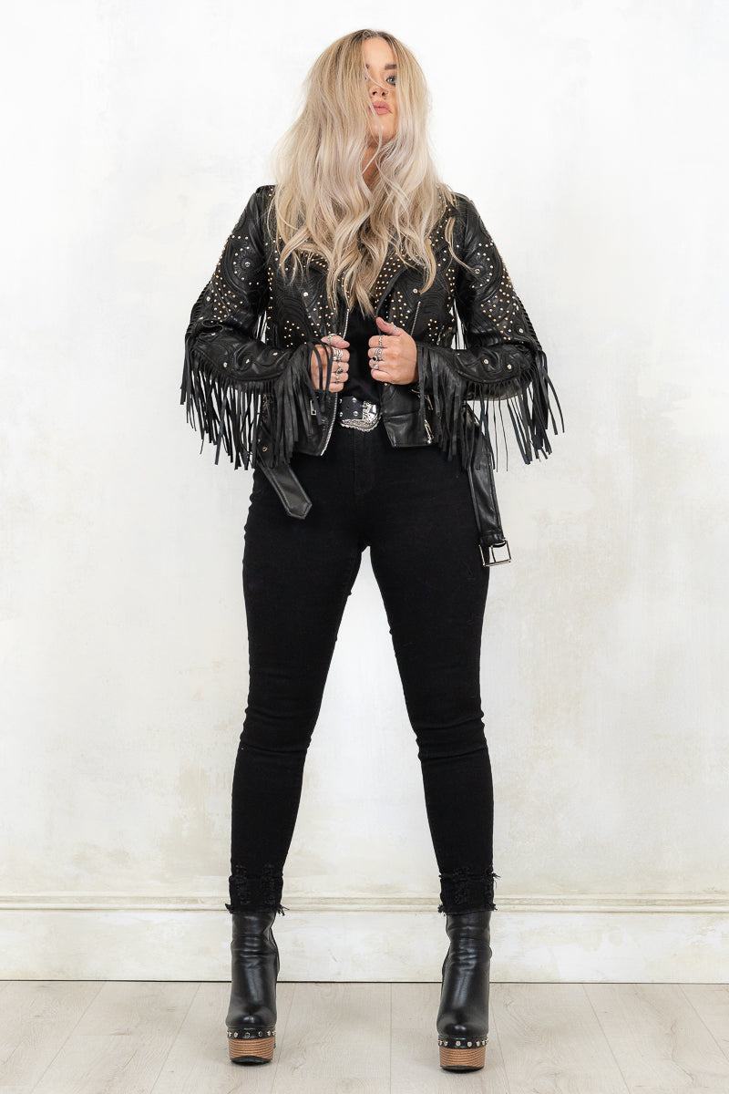 model wearing fringed and studded black colour biker jacket
